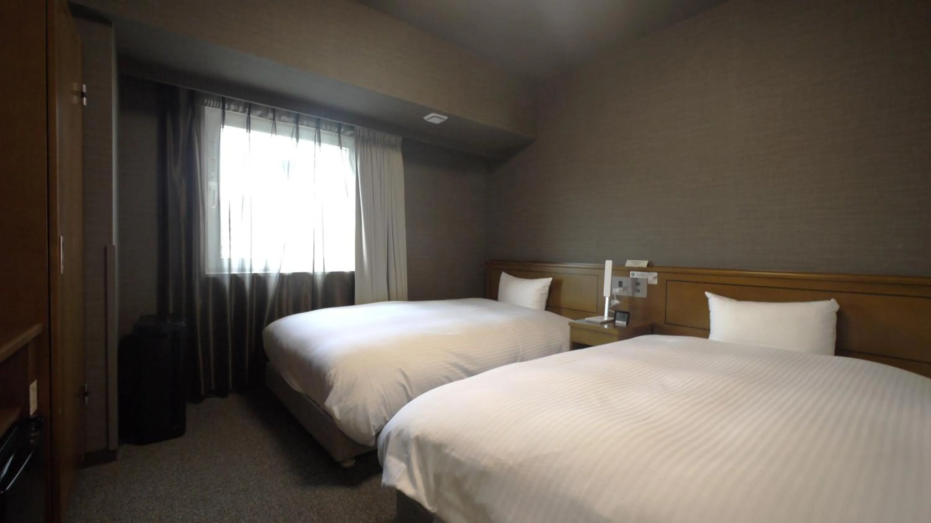 Photo of the whole room, Bed in Hotel Route-Inn Tsuruga Ekimae