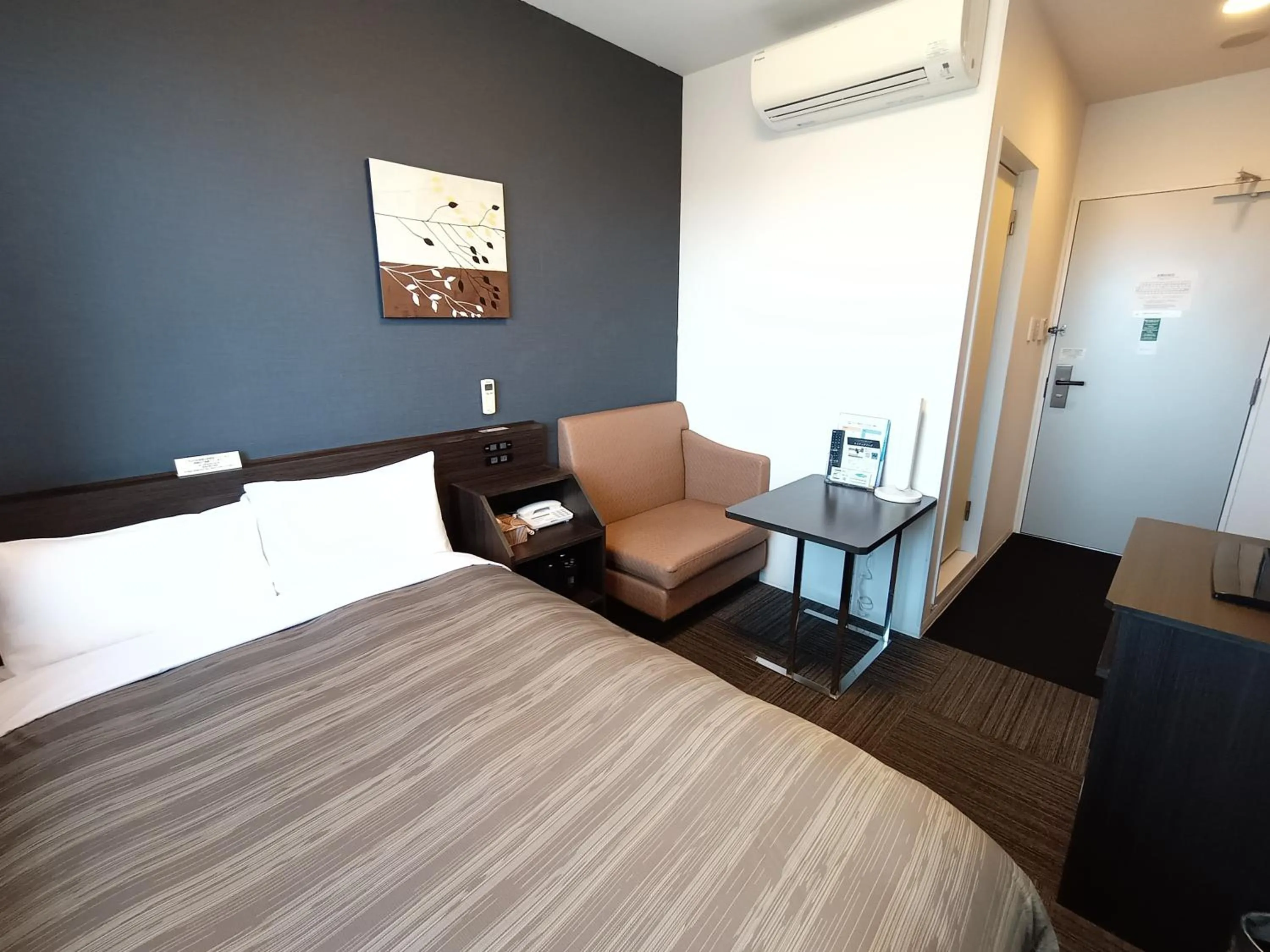 Bed in Hotel Route-Inn Iwakiizumi Ekimae