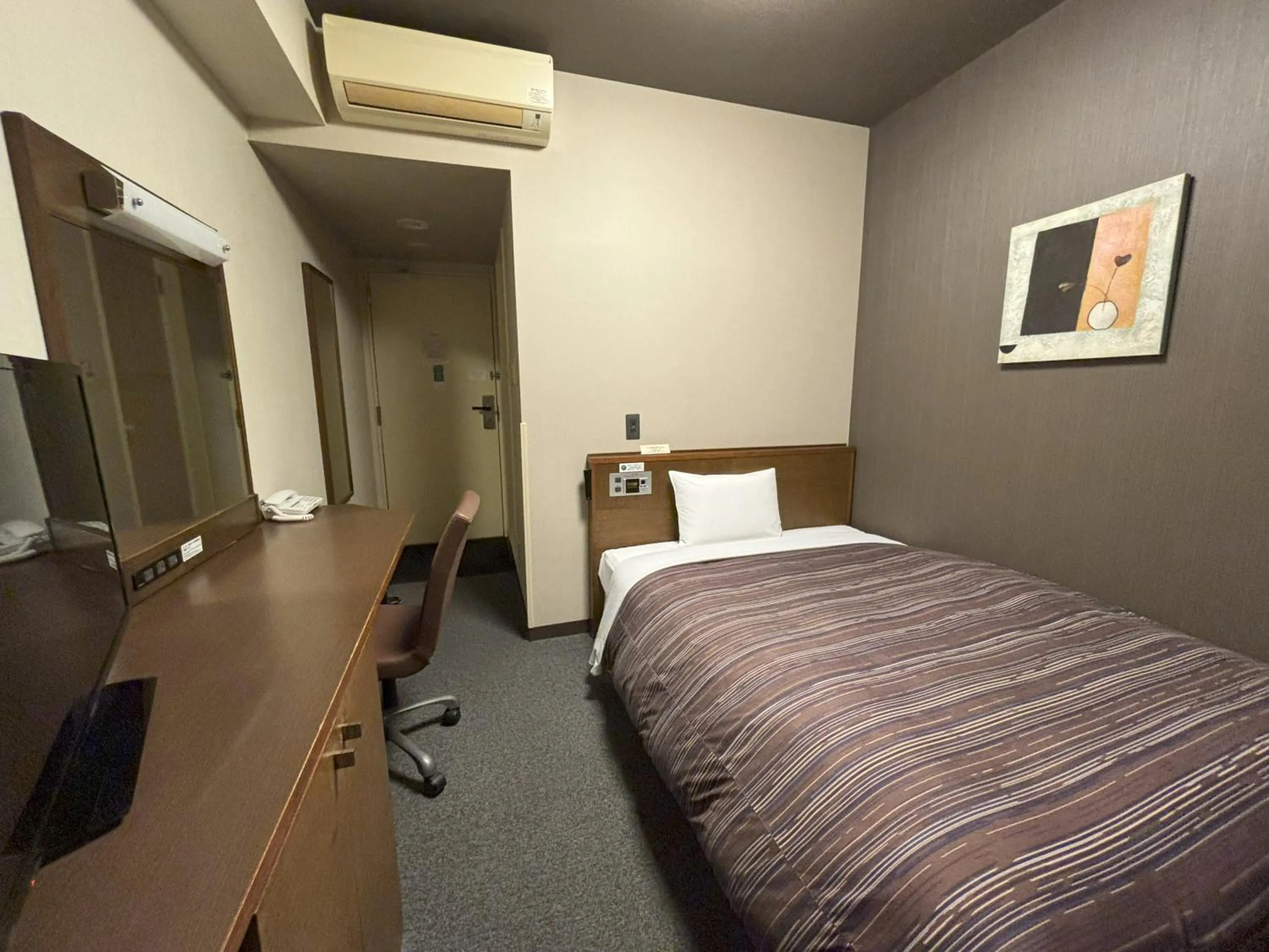 Bed in Hotel Route-Inn Iwakiizumi Ekimae