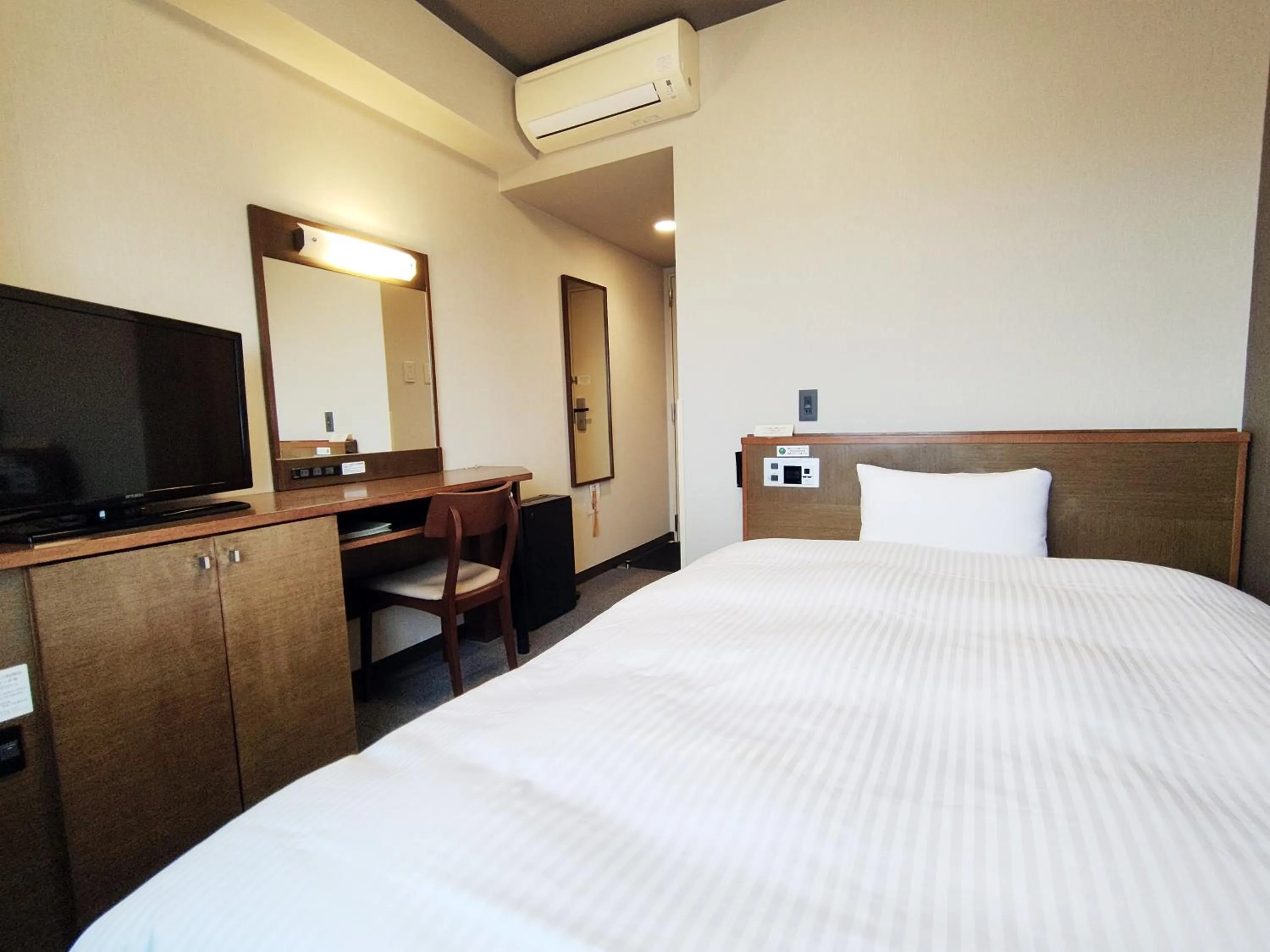 Photo of the whole room, Bed in Hotel Route-Inn Iwakiizumi Ekimae