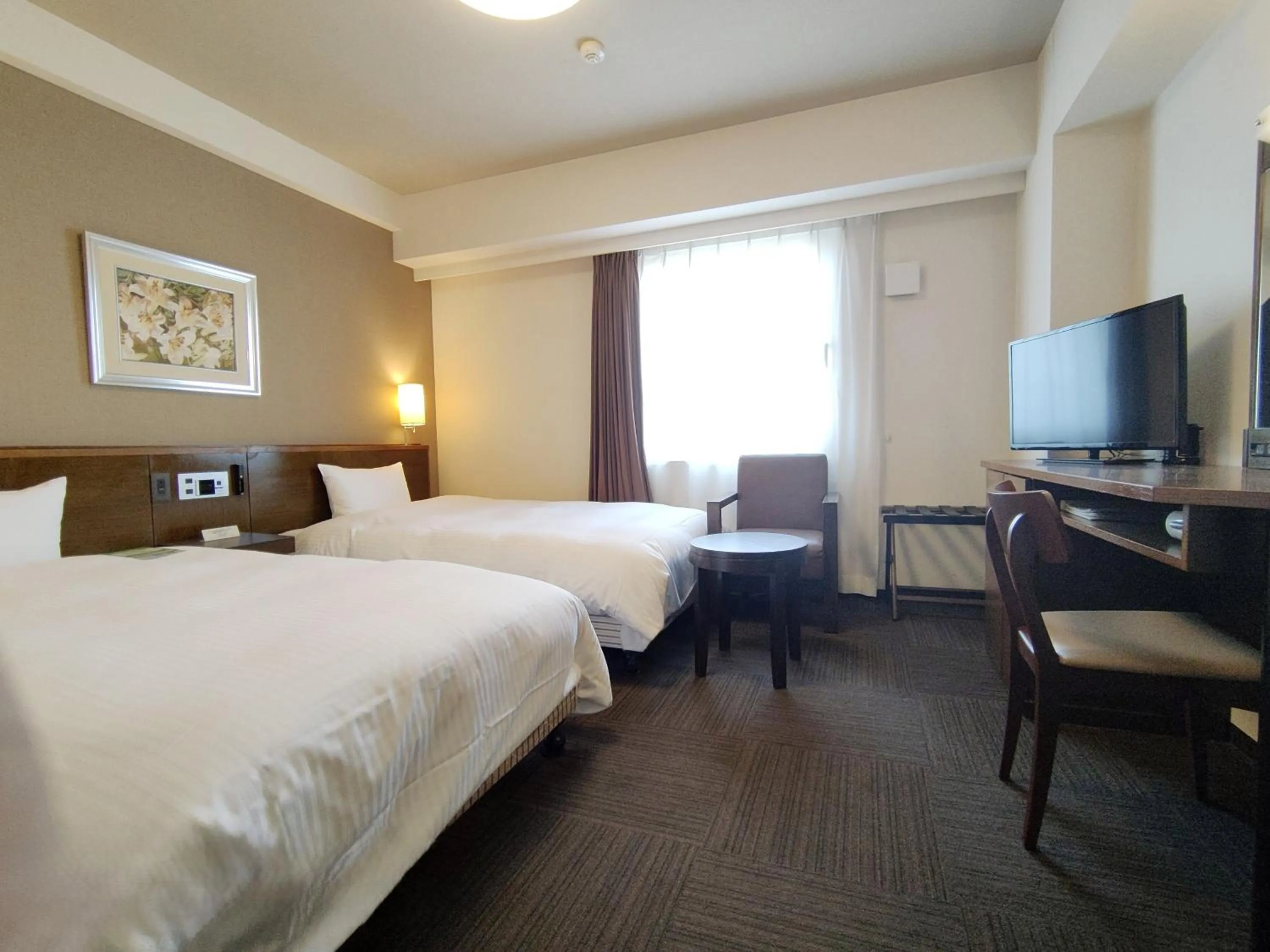 Photo of the whole room, Bed in Hotel Route-Inn Iwakiizumi Ekimae