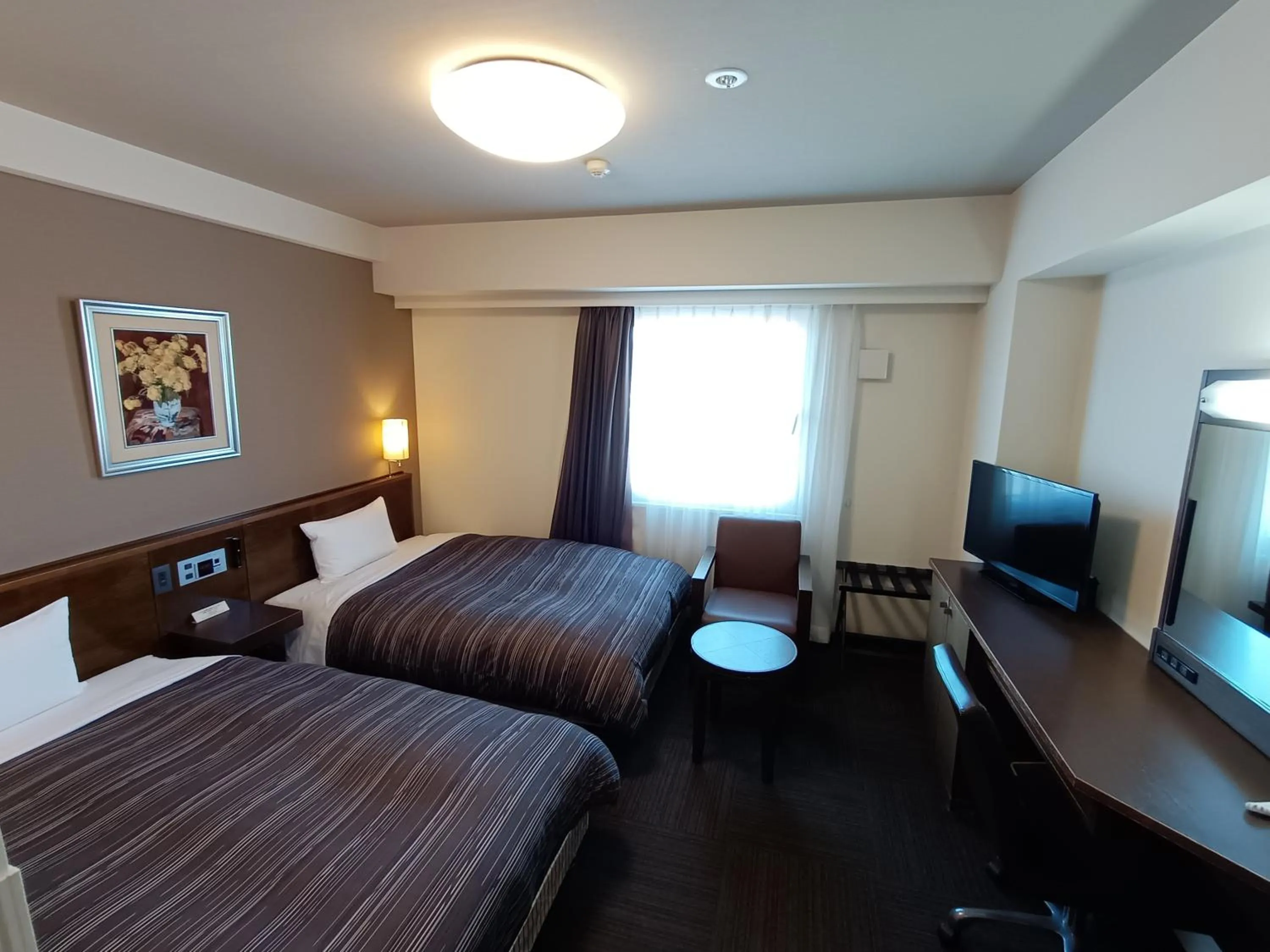 Bed in Hotel Route-Inn Iwakiizumi Ekimae