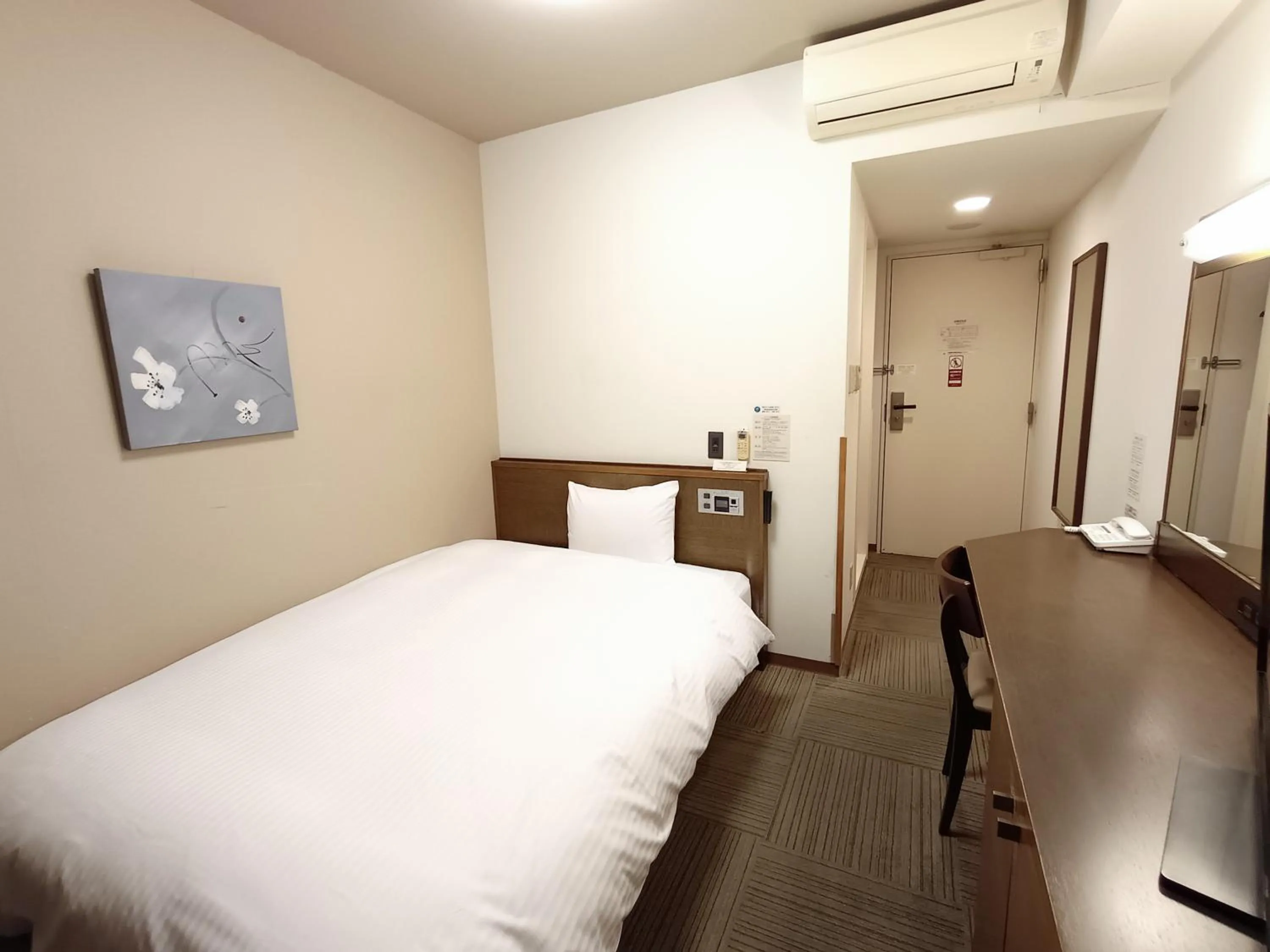 Photo of the whole room, Bed in Hotel Route-Inn Iwakiizumi Ekimae