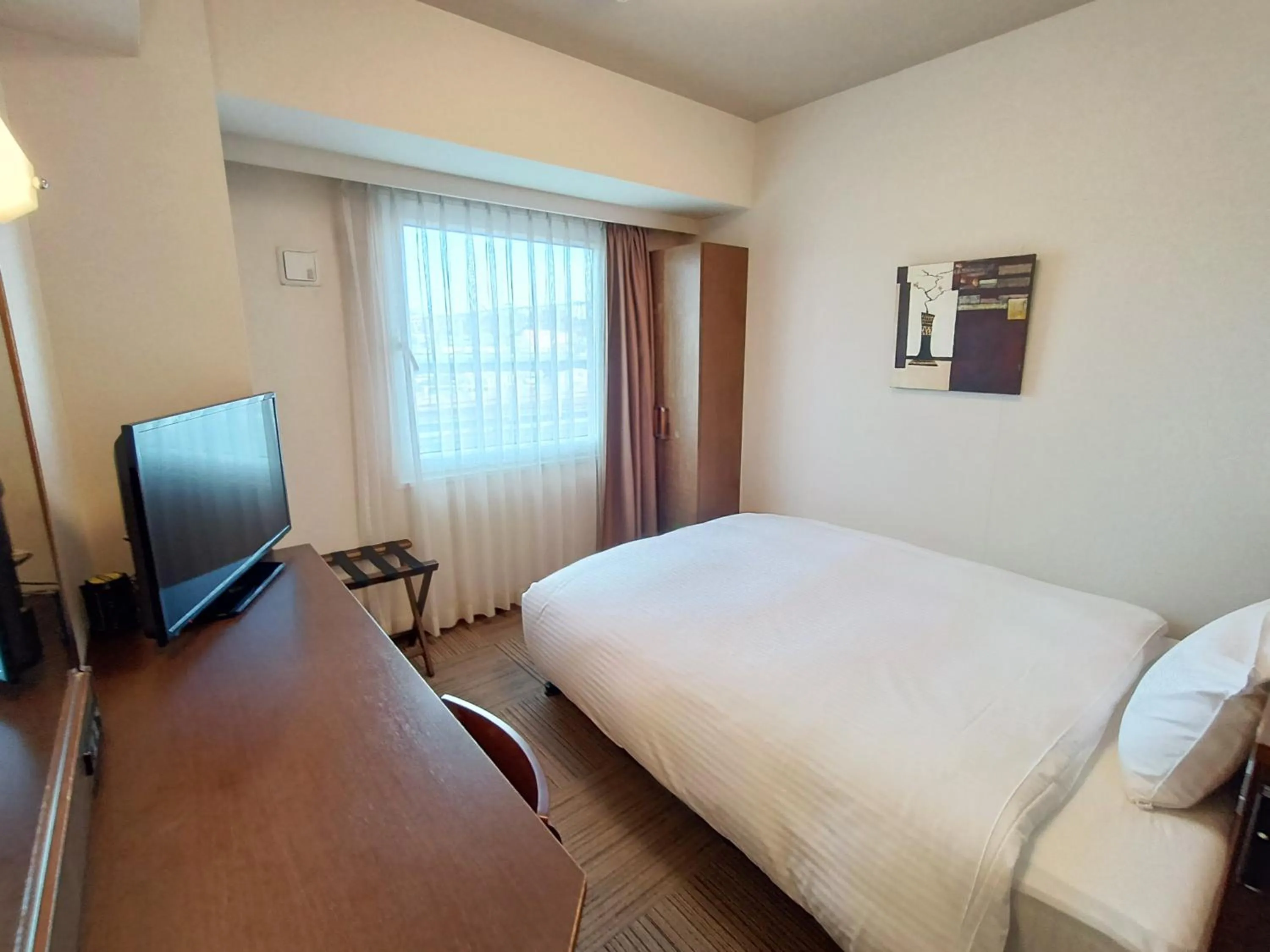 Photo of the whole room, Bed in Hotel Route-Inn Iwakiizumi Ekimae