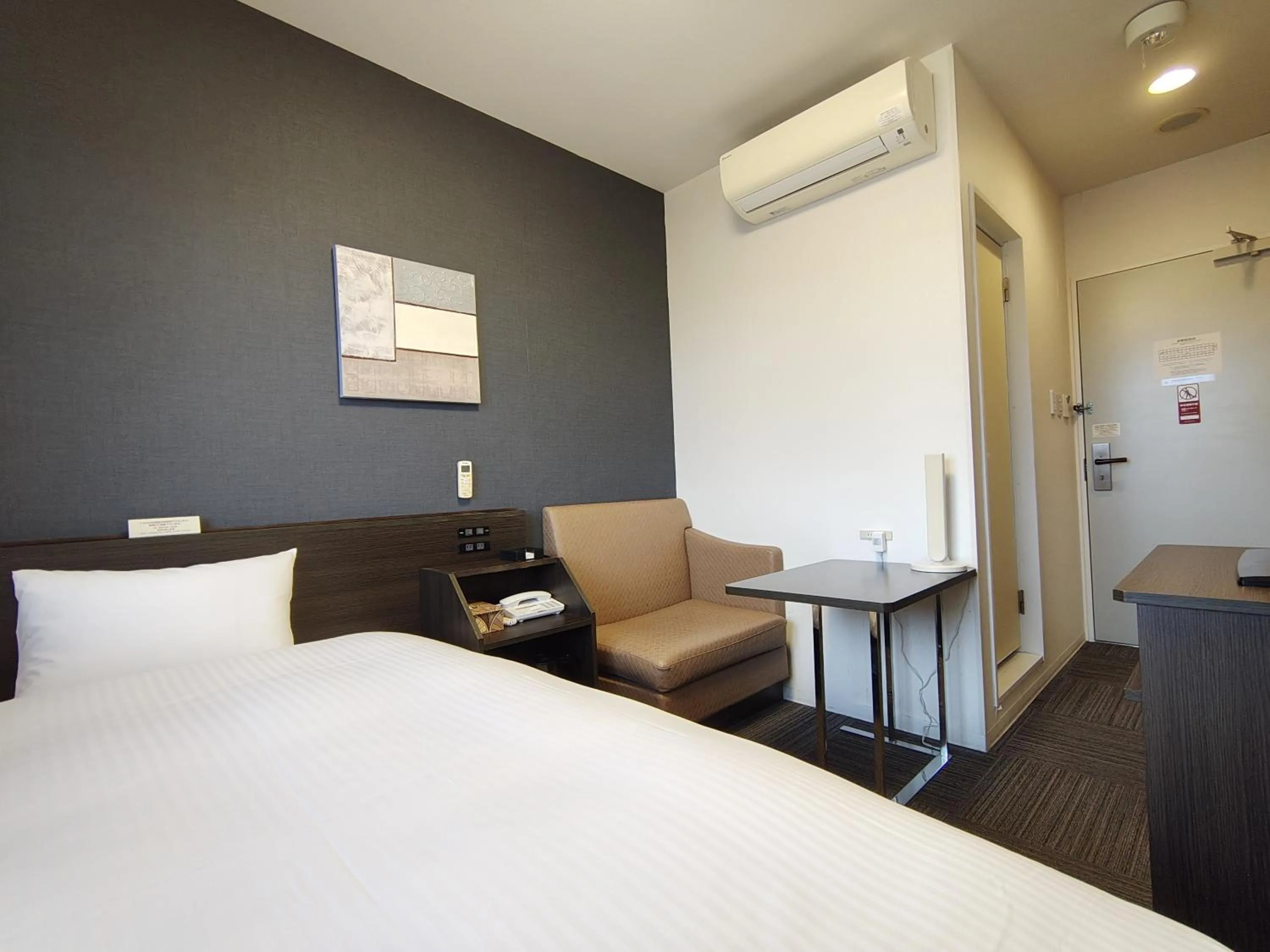 Photo of the whole room, Bed in Hotel Route-Inn Iwakiizumi Ekimae