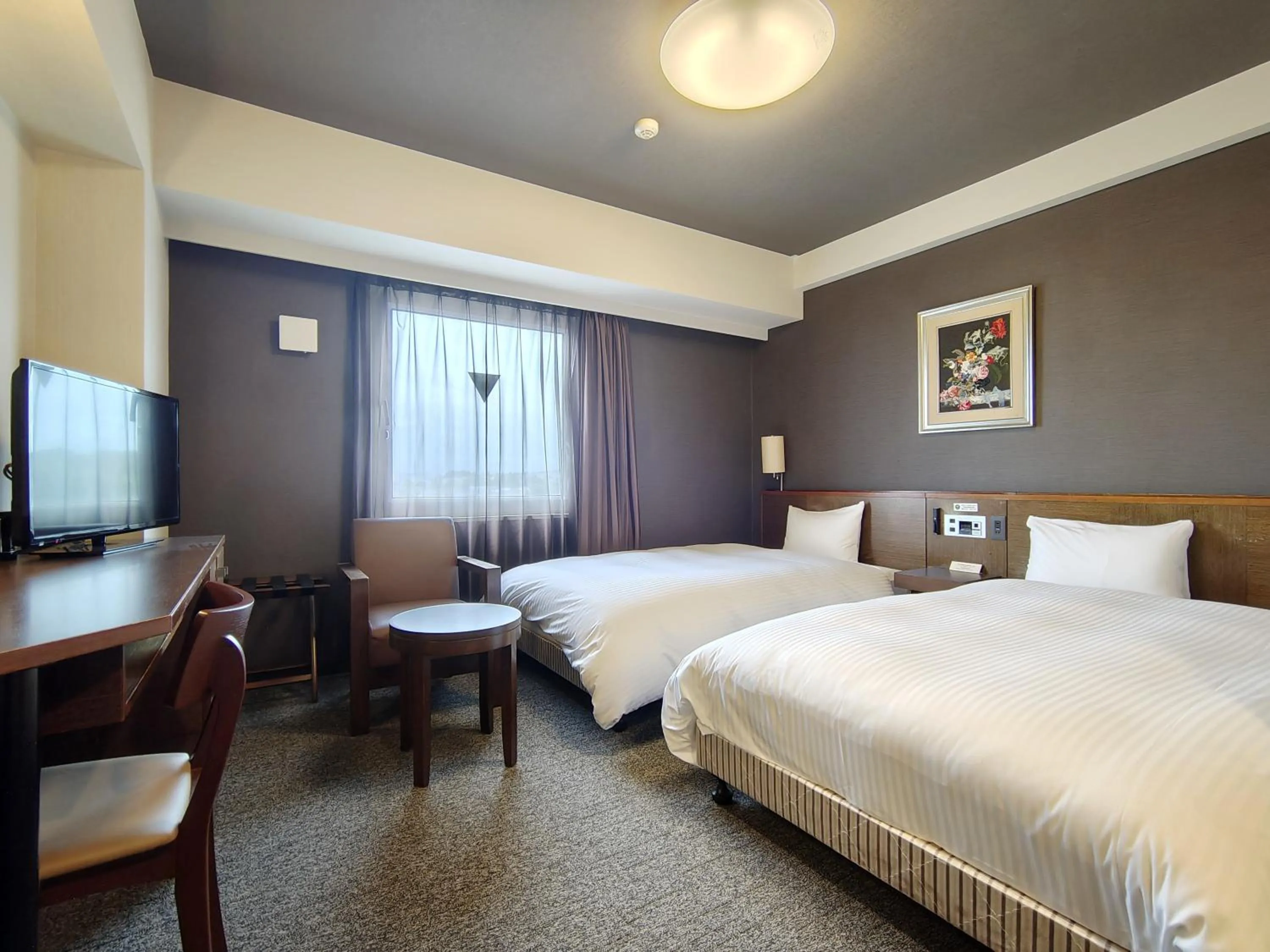 Photo of the whole room, Bed in Hotel Route-Inn Iwakiizumi Ekimae
