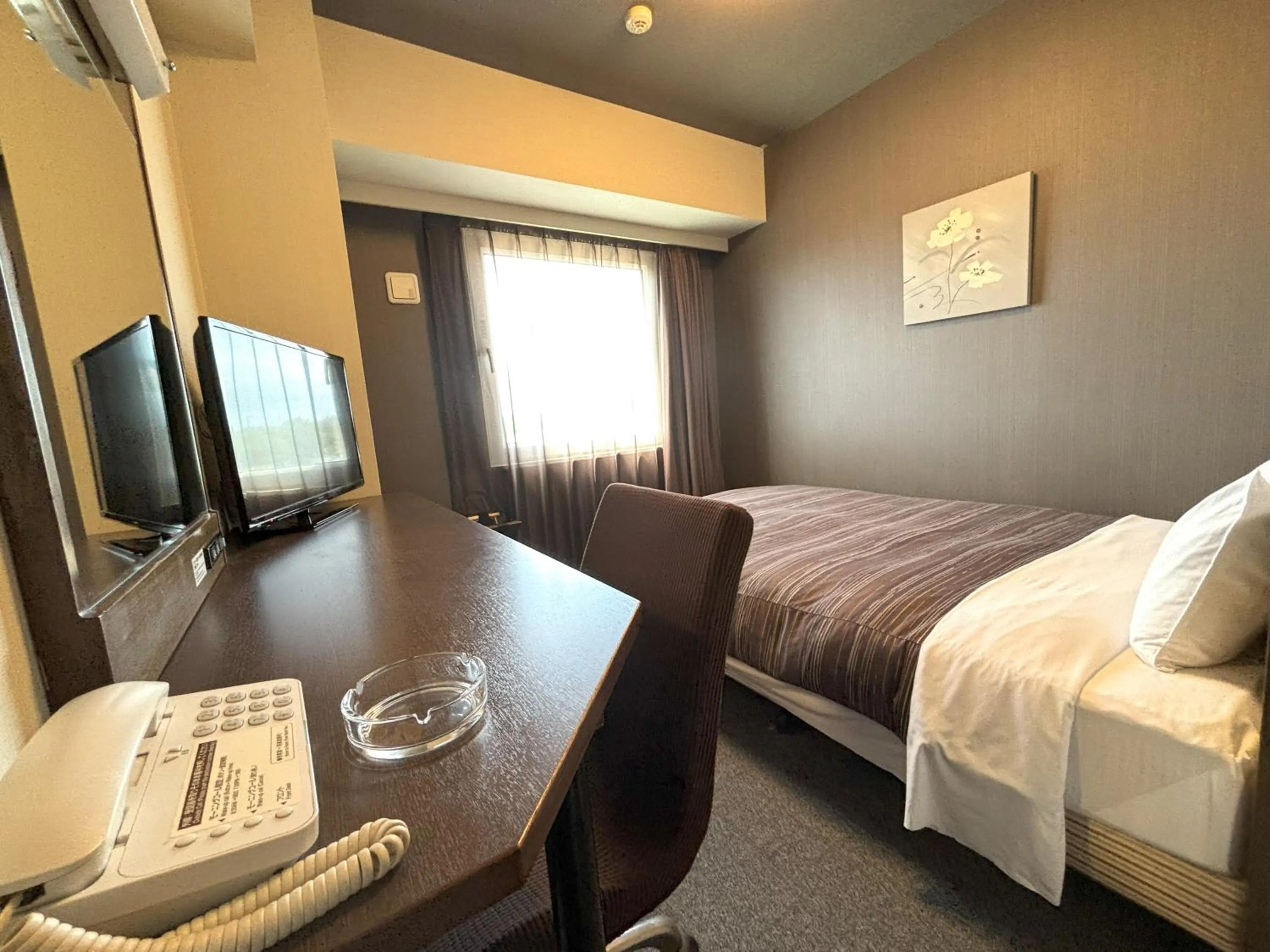 Bed in Hotel Route-Inn Iwakiizumi Ekimae