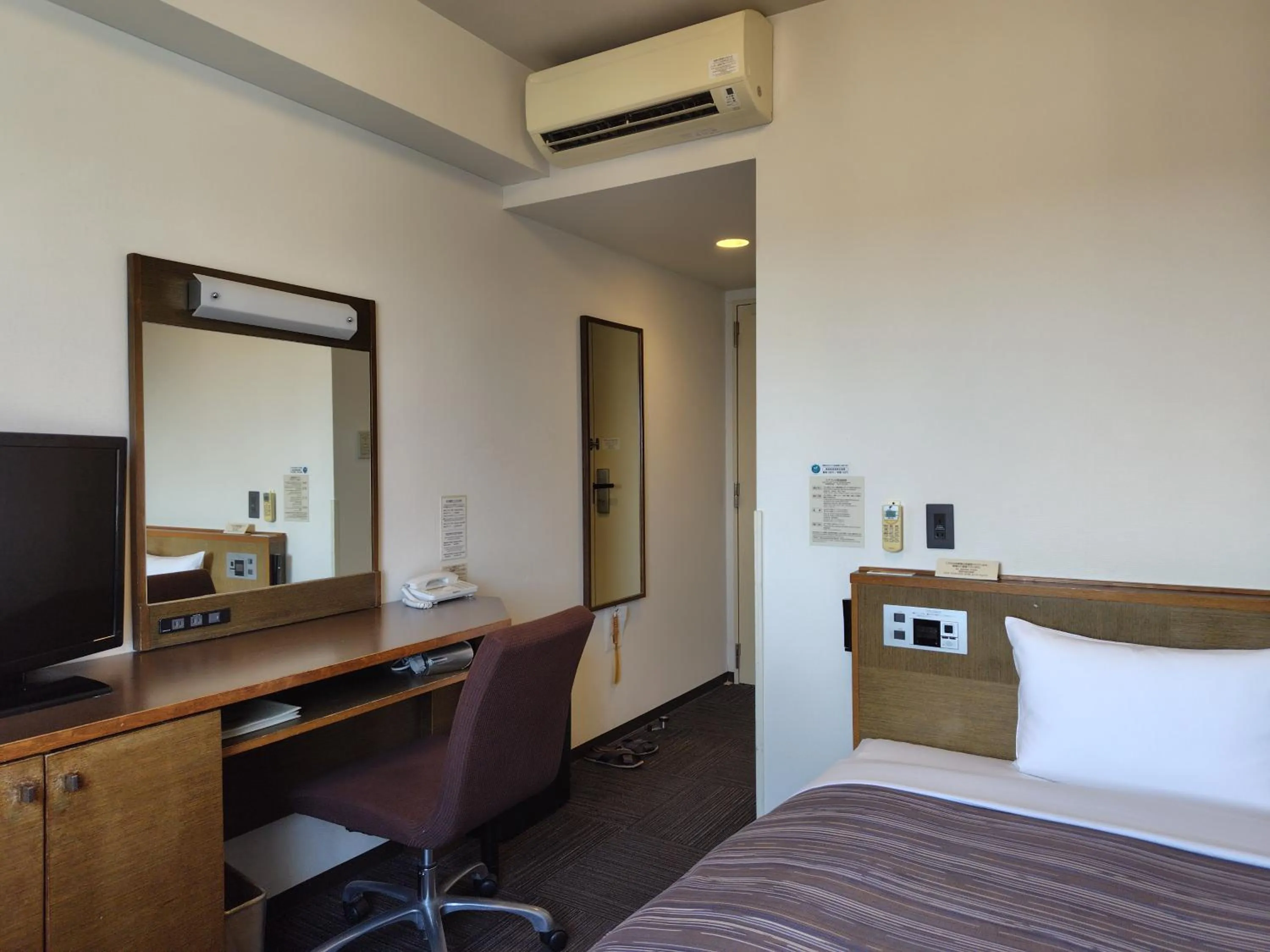 Bed in Hotel Route-Inn Iwakiizumi Ekimae