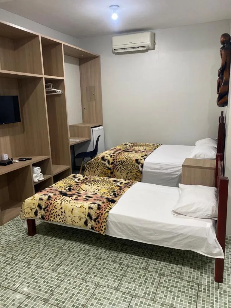 Bed in Pousada Encantos da Amazônia