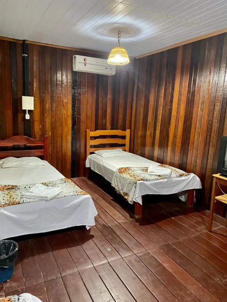 Bed in Pousada Encantos da Amazônia