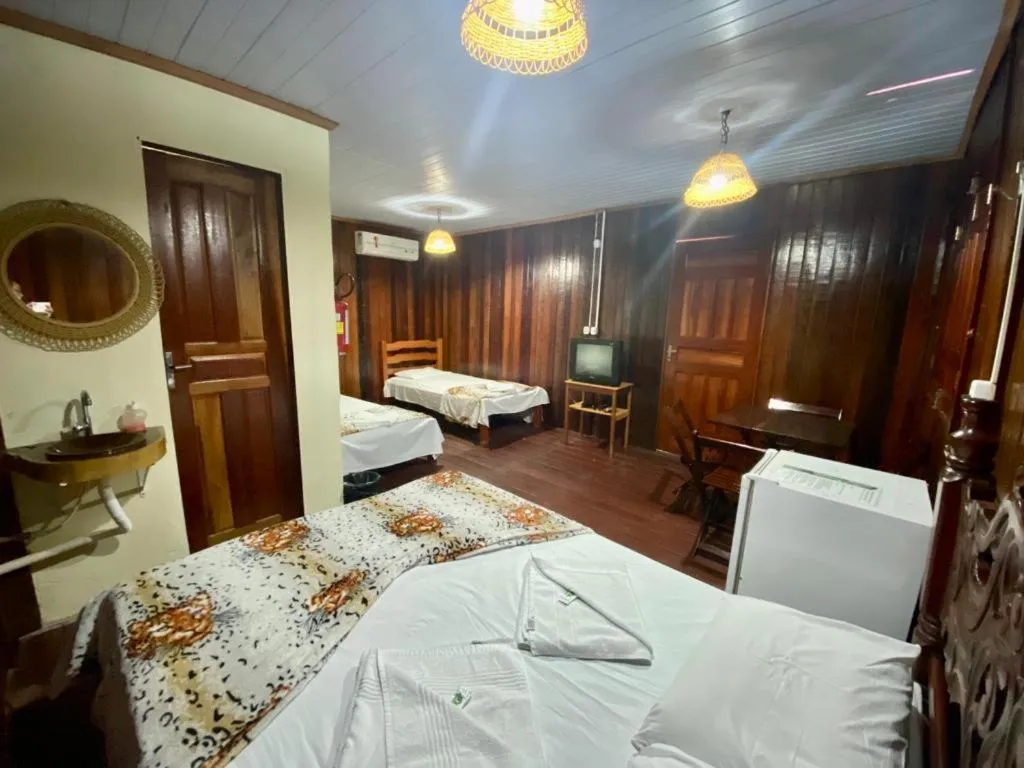 Bed in Pousada Encantos da Amazônia