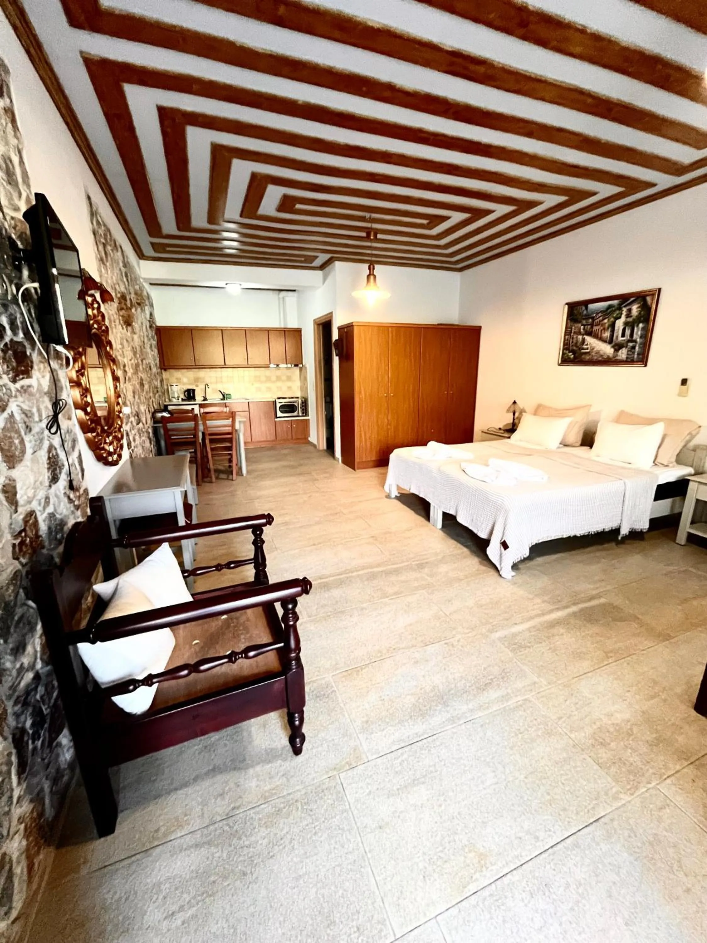 Bed in Pantheon Apartments & Studios