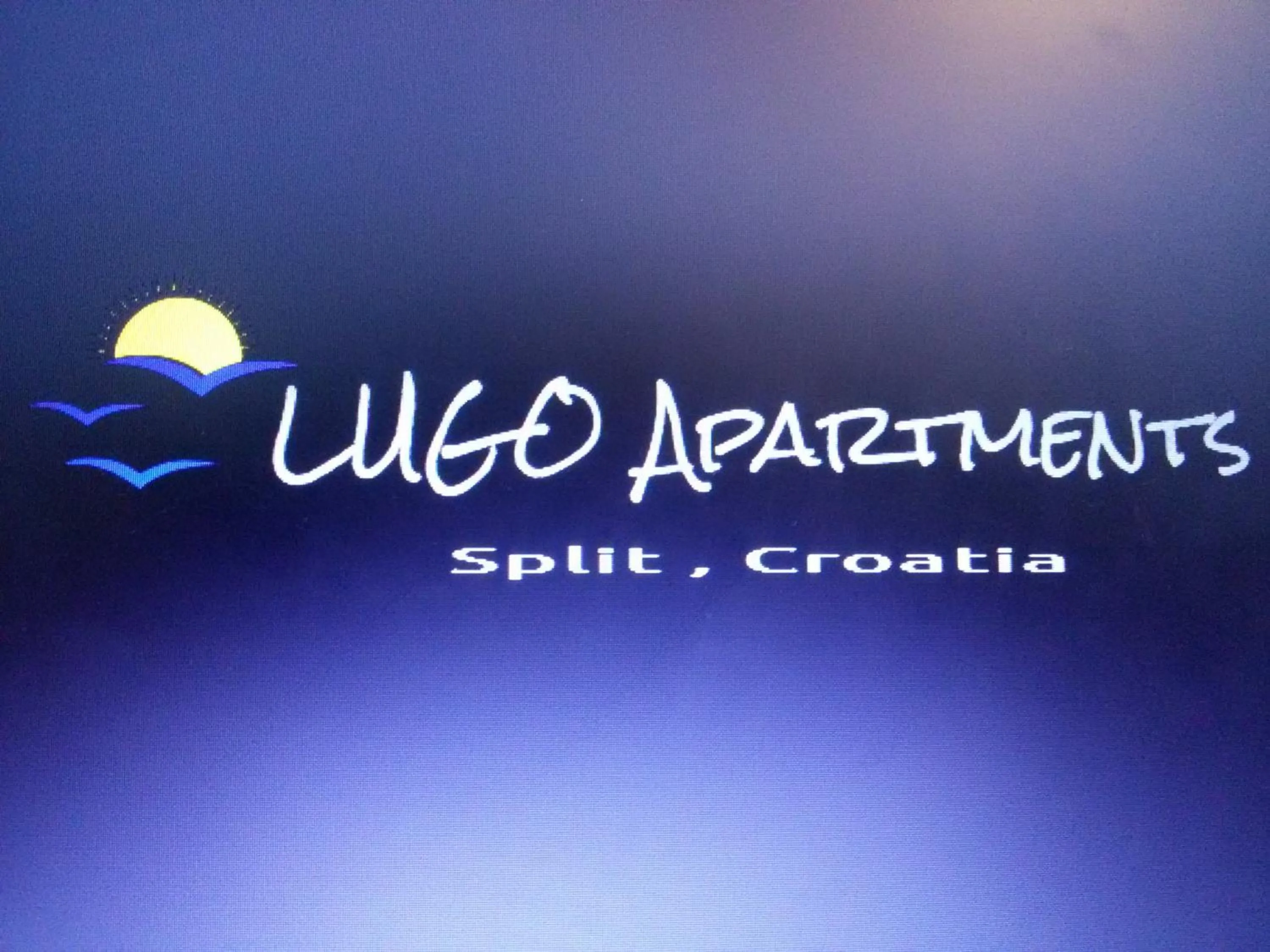 Property logo or sign in Lugo Apartments