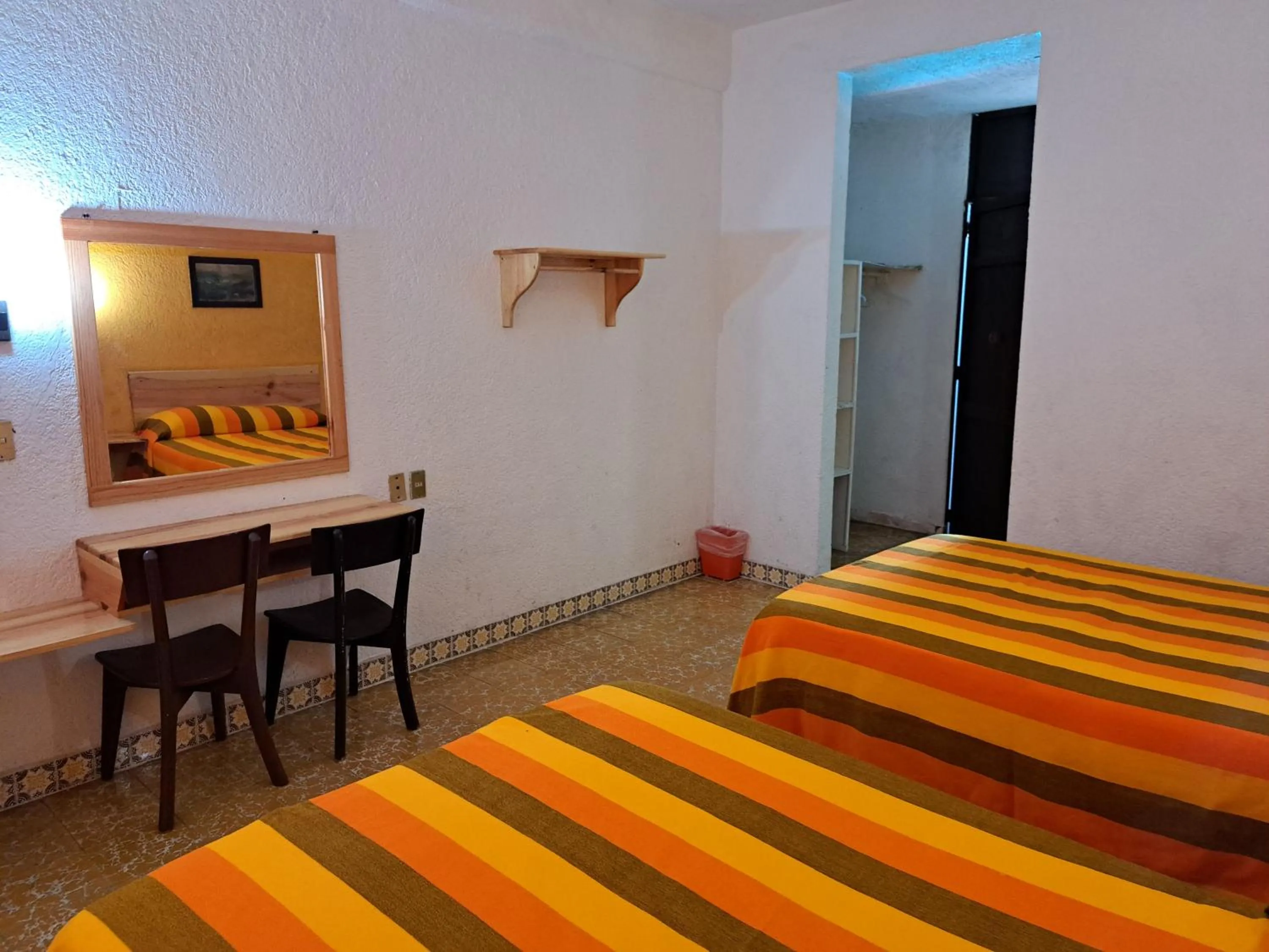 Bed, TV/Entertainment Center in Hotel Playa Azul