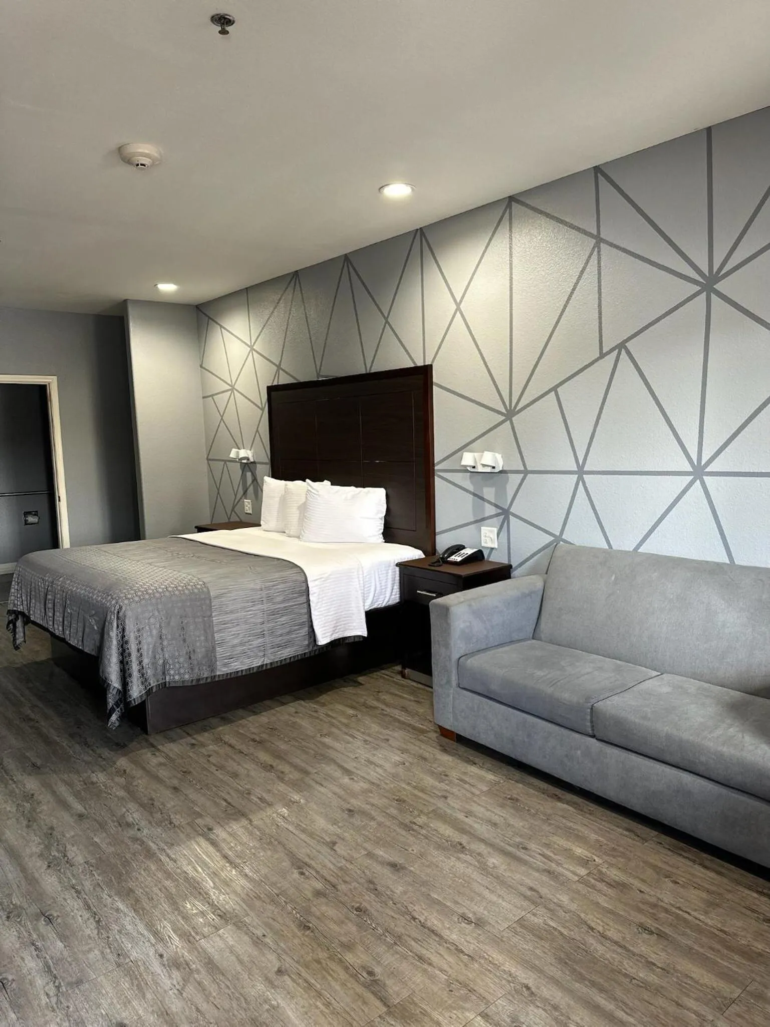 Bed in Atlantis Inn Suites