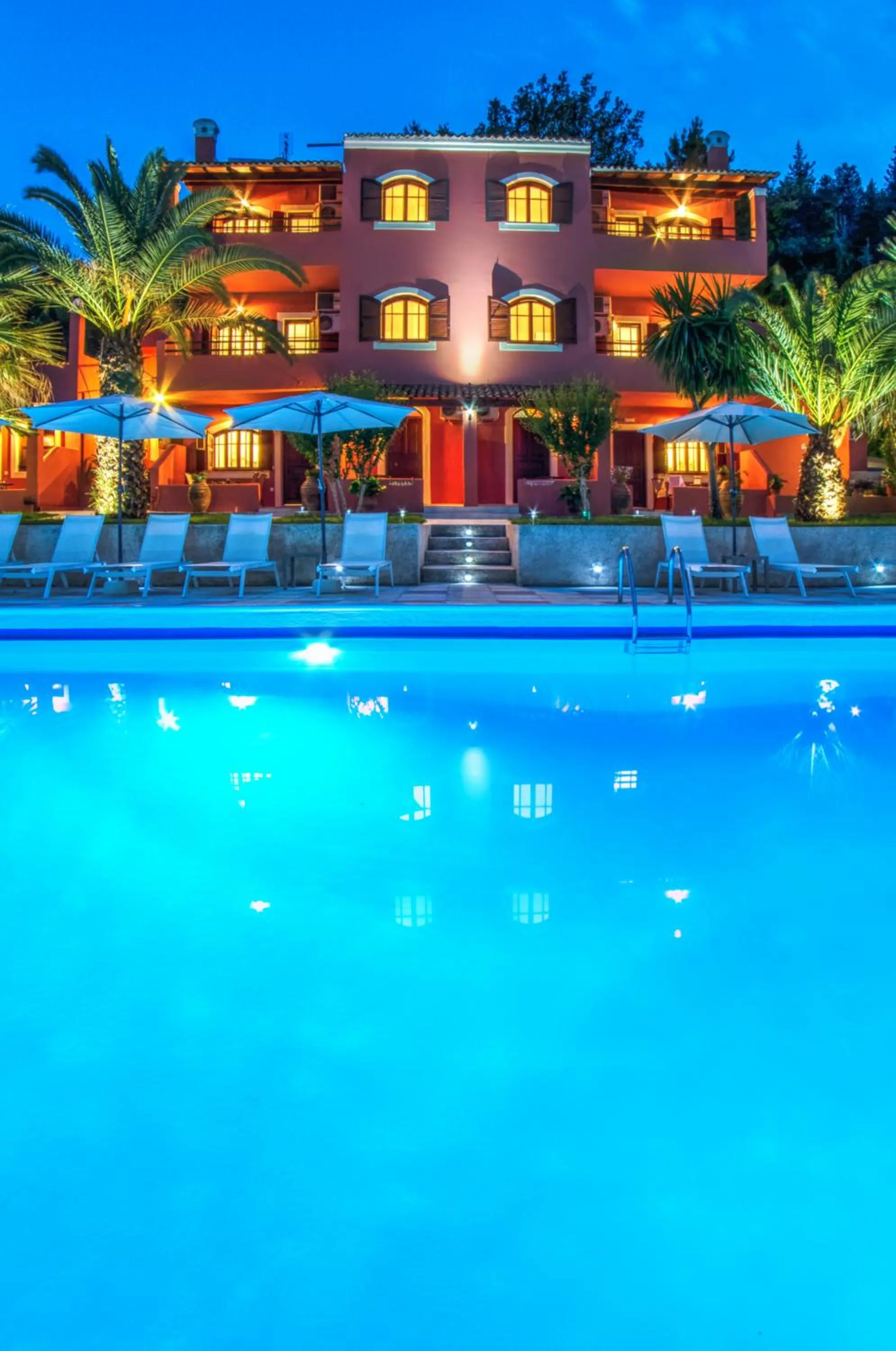 Property building in The Palm Garden - Idyllic Pool Apartments in a Green Oasis