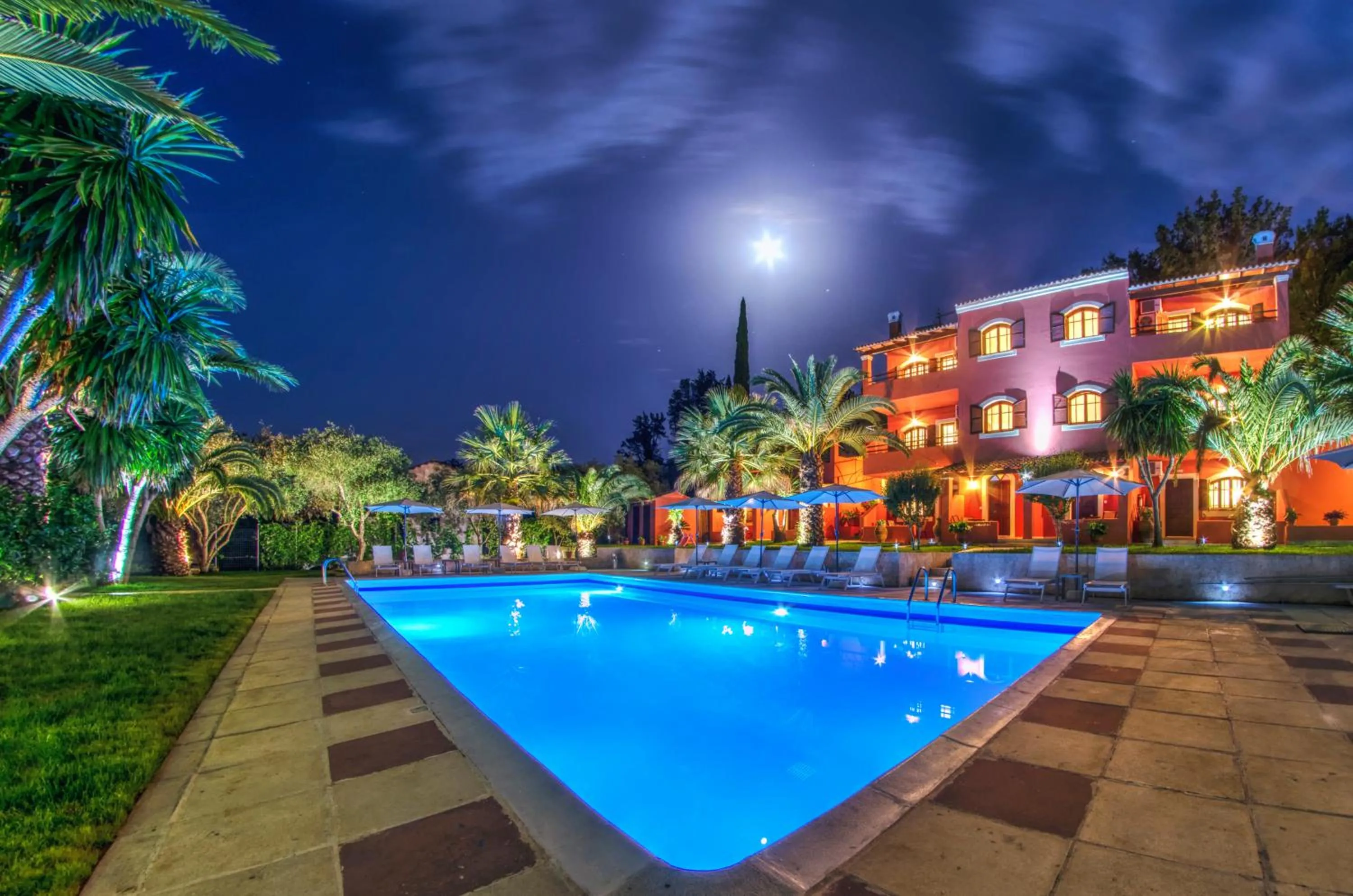 Property building in The Palm Garden - Idyllic Pool Apartments in a Green Oasis