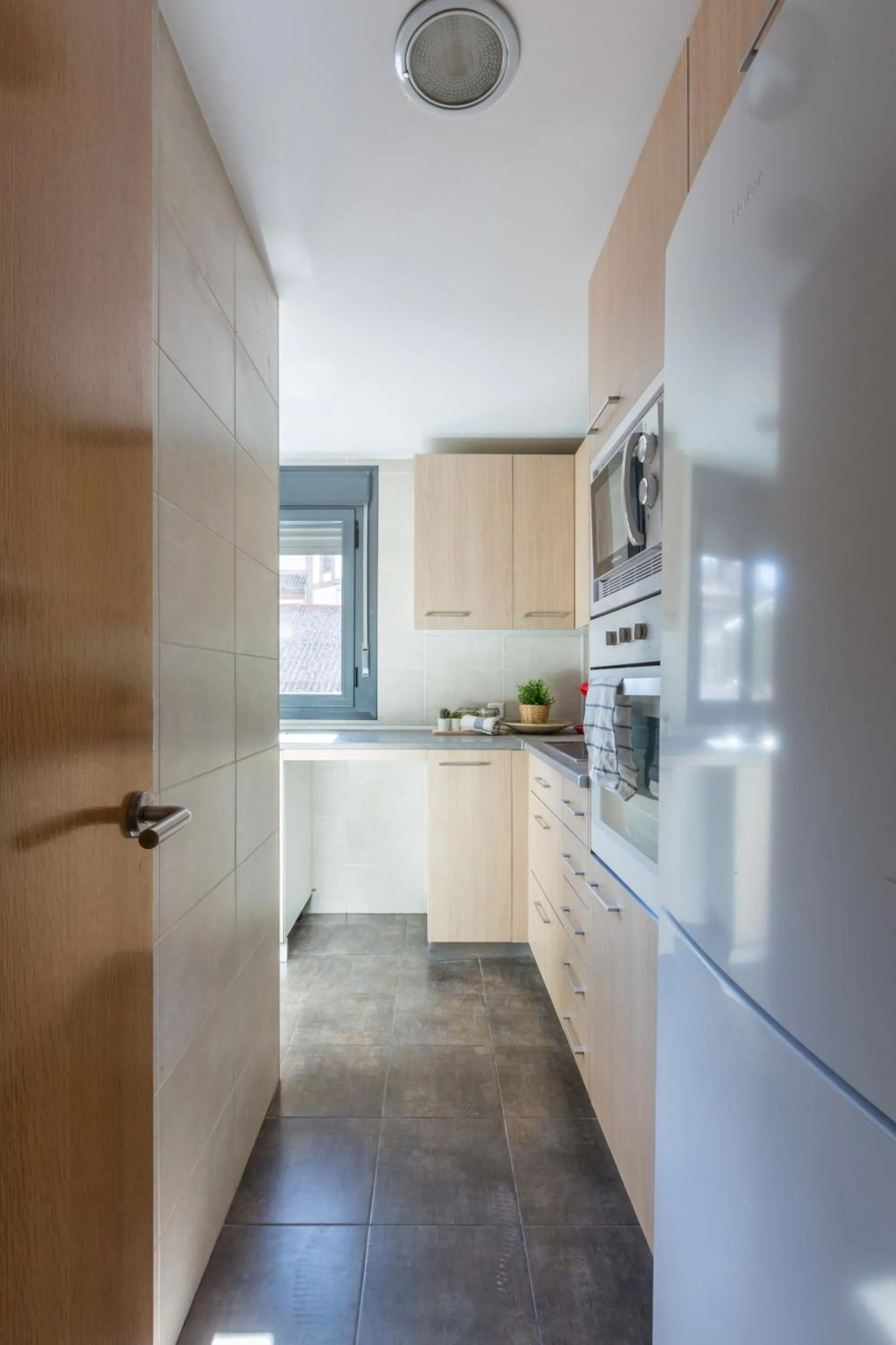 Kitchen or kitchenette in Horoko Apartments by gaiarooms