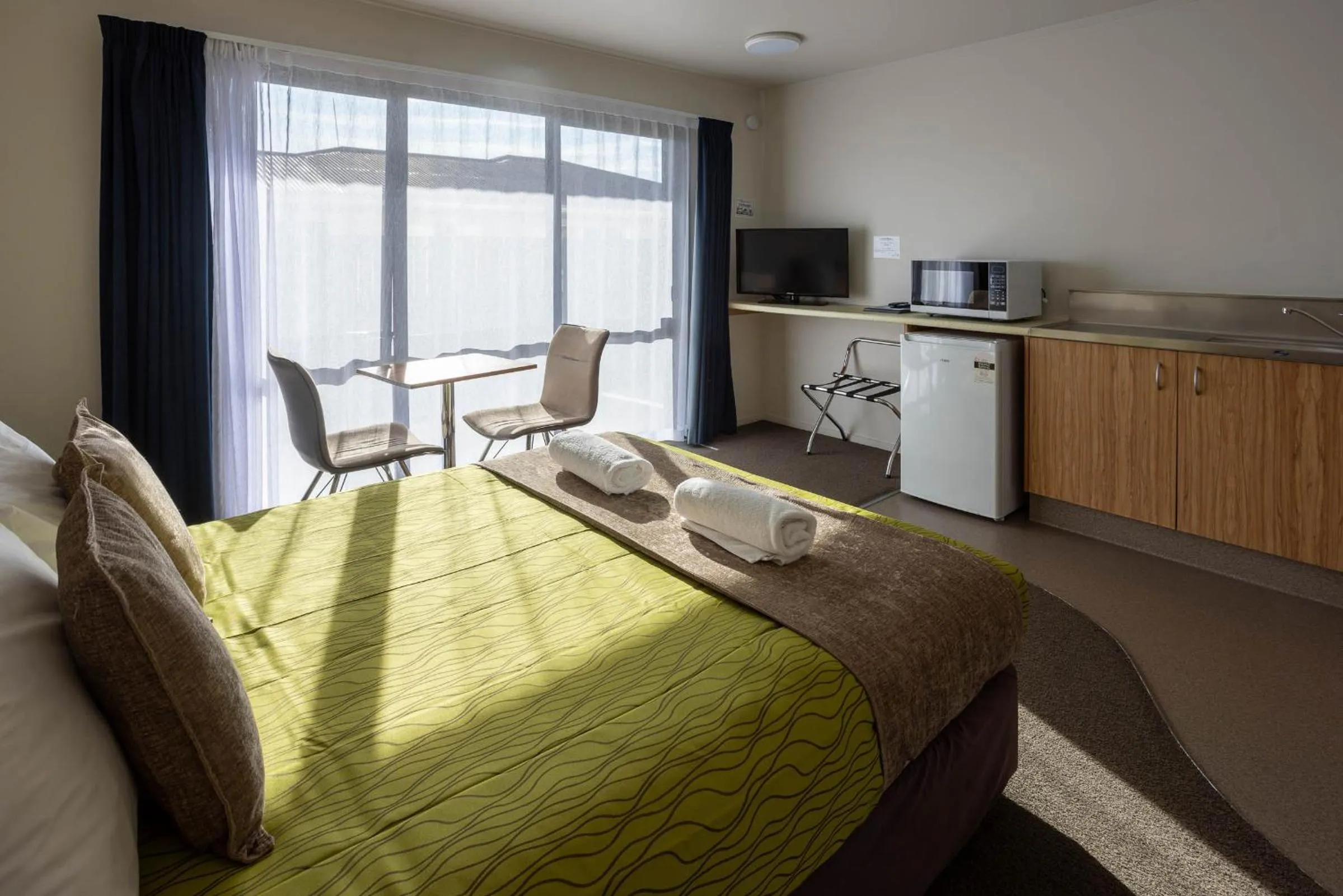 Bed in Alpine Glacier Motel