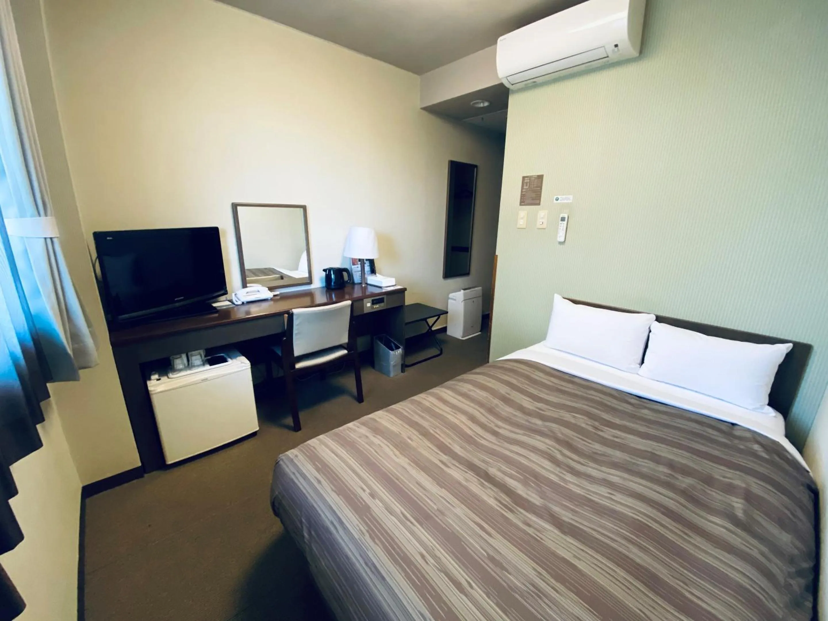 Photo of the whole room, Bed in Hotel Route-Inn Kamisuwa