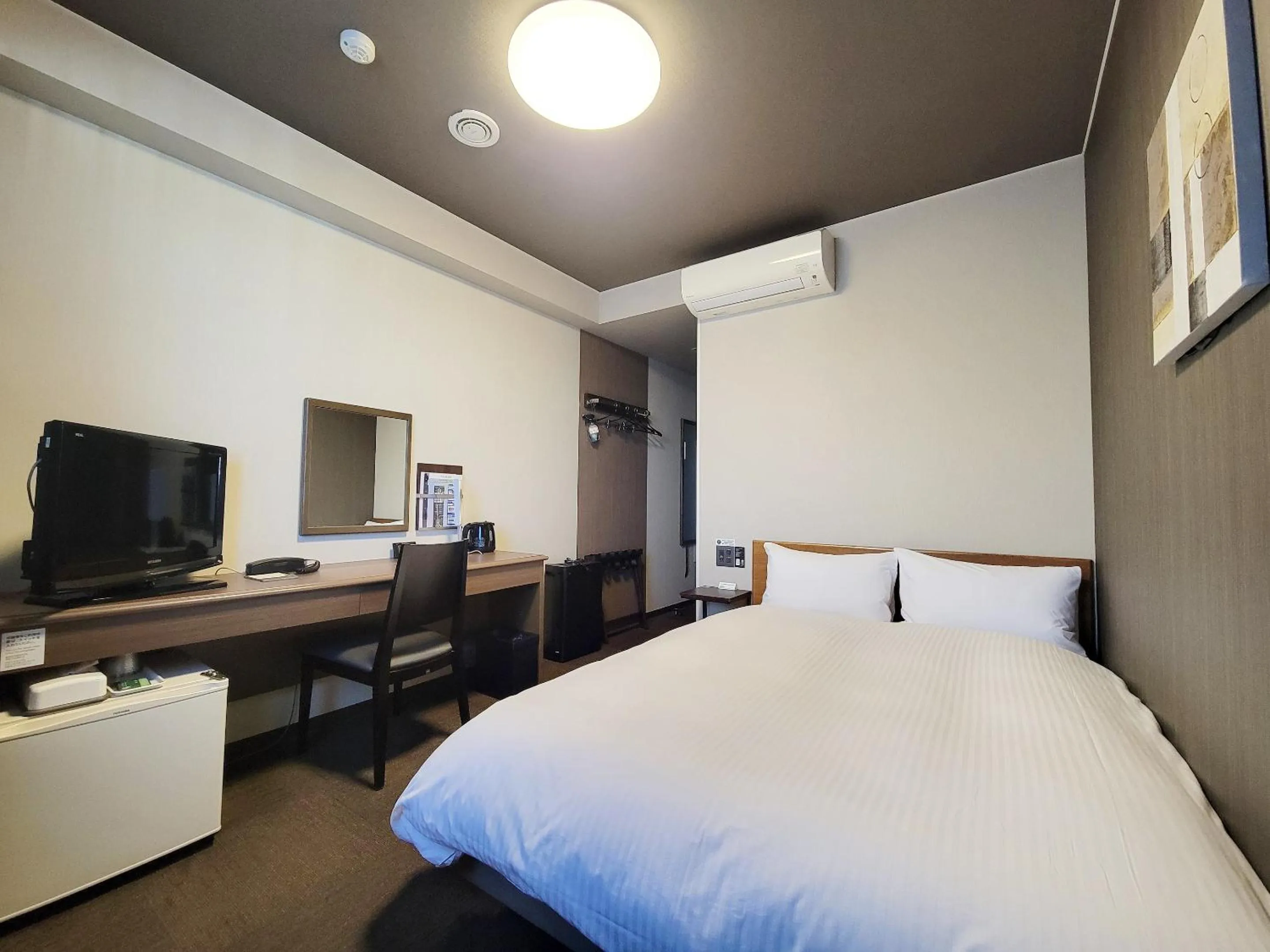 Photo of the whole room, Bed in Hotel Route-Inn Komoro