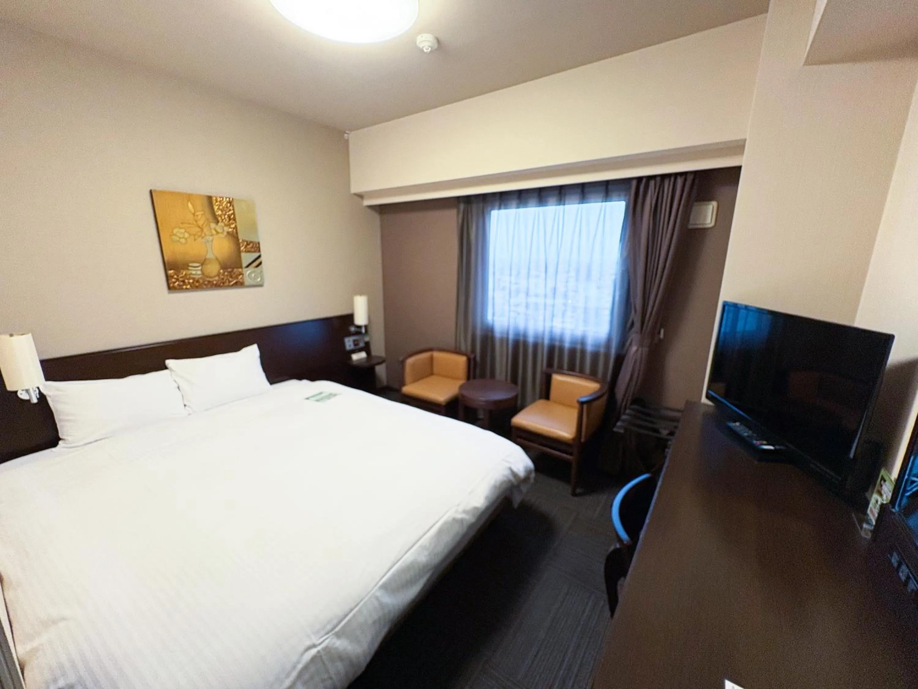 Photo of the whole room, Bed in Hotel Route-Inn Tsuruoka Ekimae