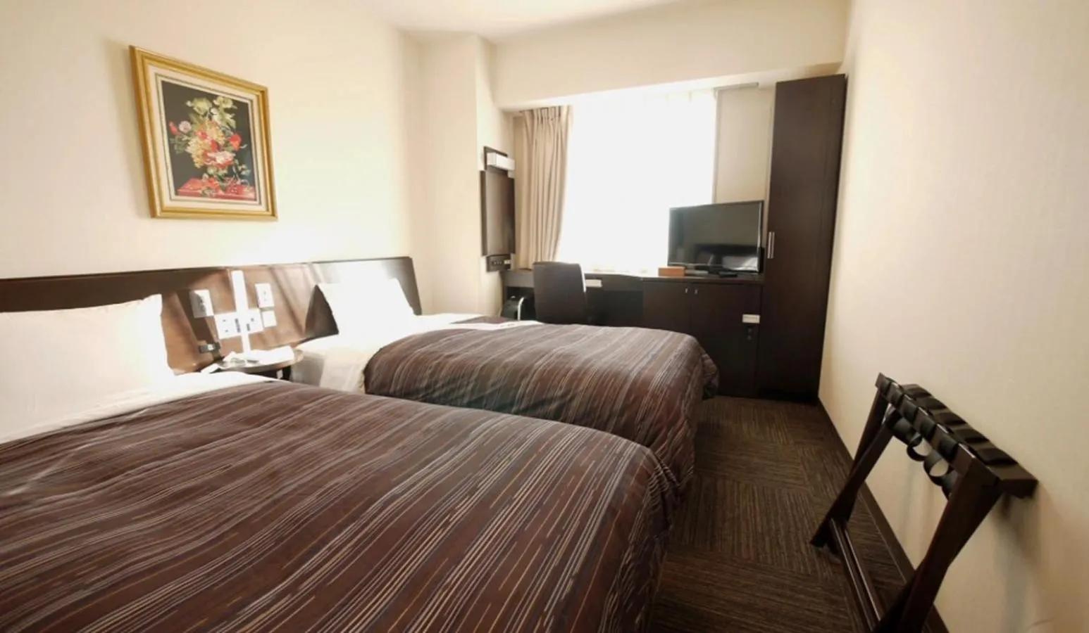 Photo of the whole room, Bed in Hotel Route-Inn Tomakomai Ekimae