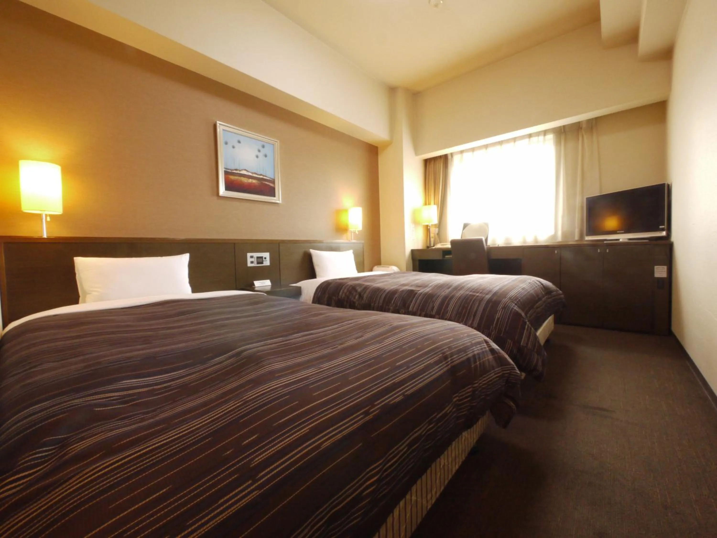 Photo of the whole room, Bed in Hotel Route-Inn Higashimuroran Ekimae