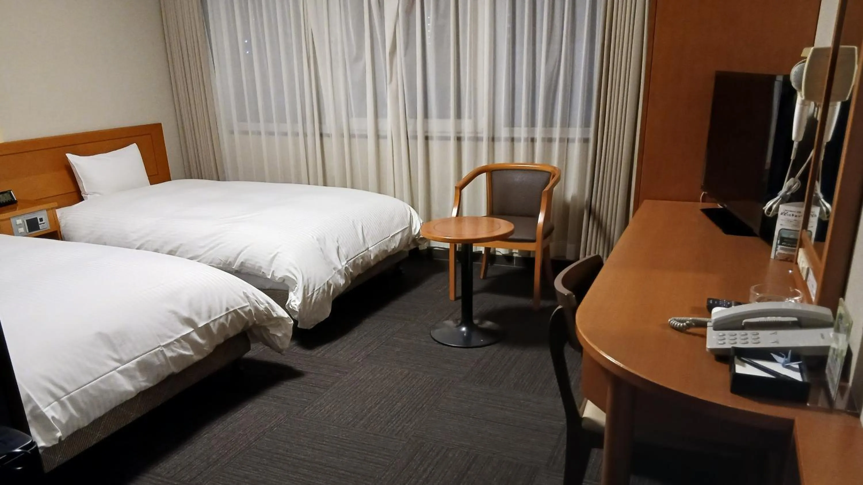 Photo of the whole room, Bed in Hotel Route-Inn Saga Ekimae