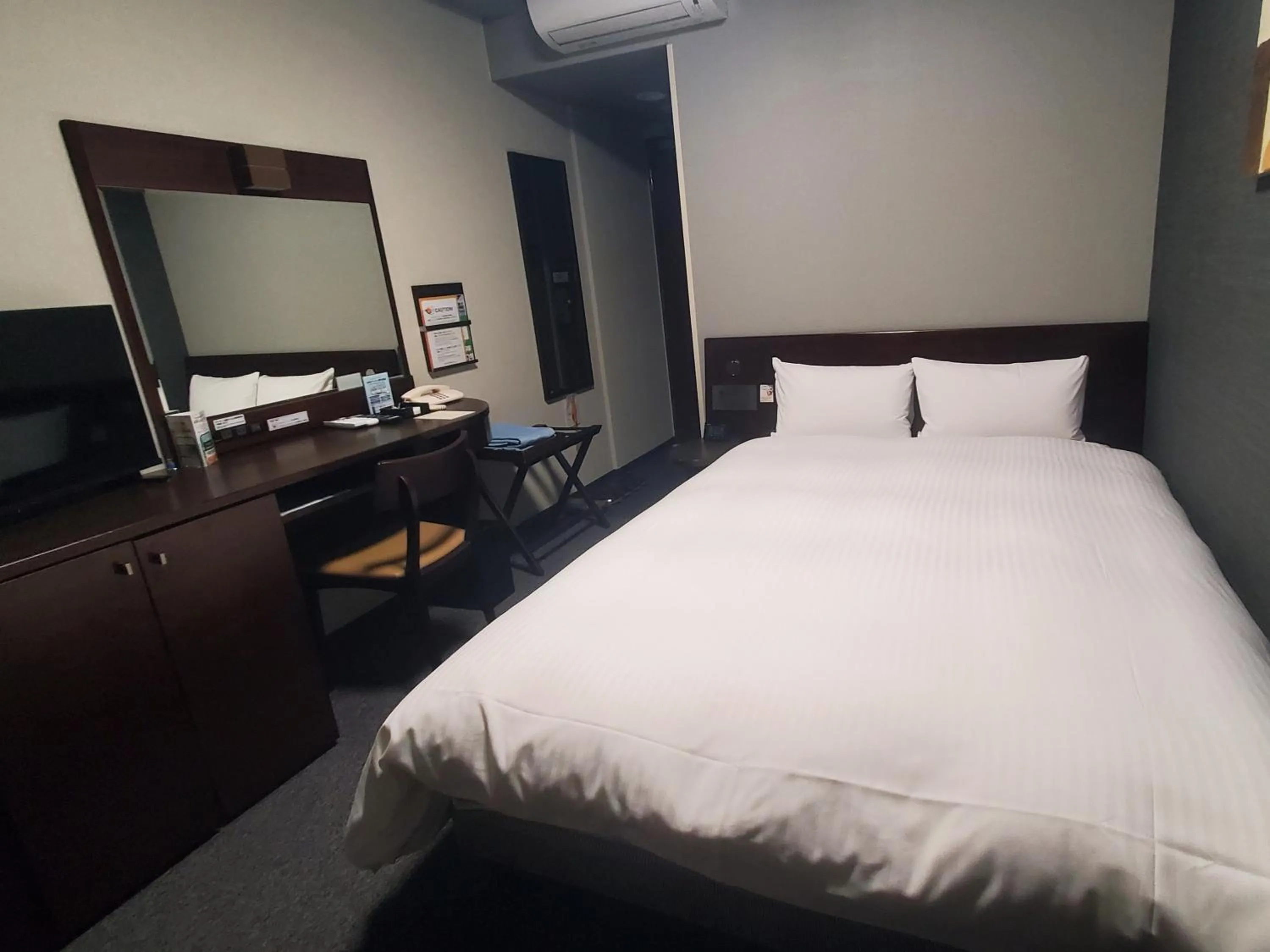 Photo of the whole room, Bed in Hotel Route-Inn Saga Ekimae