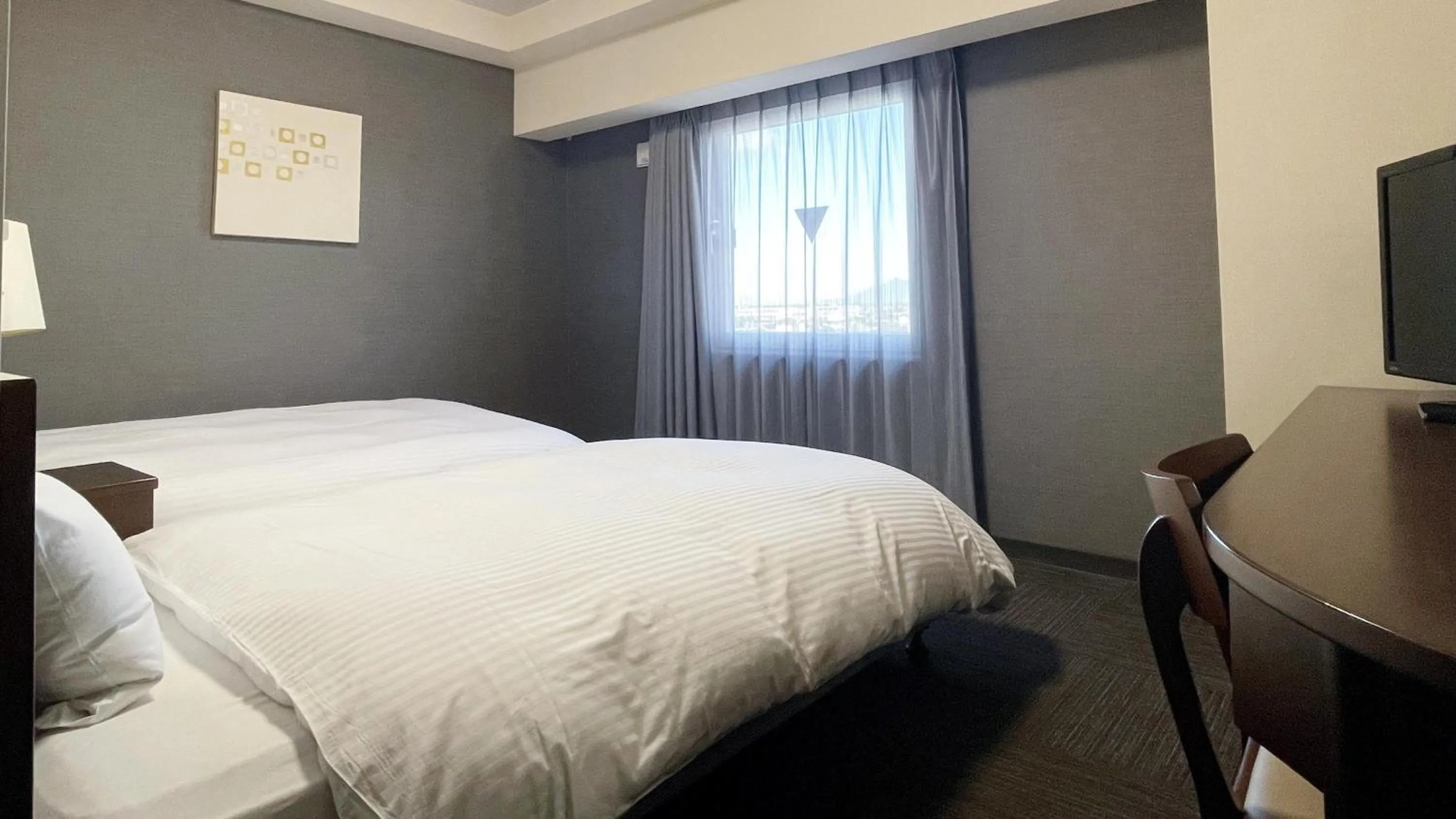 Photo of the whole room, Bed in Hotel Route-Inn Mitsukaido Ekimae