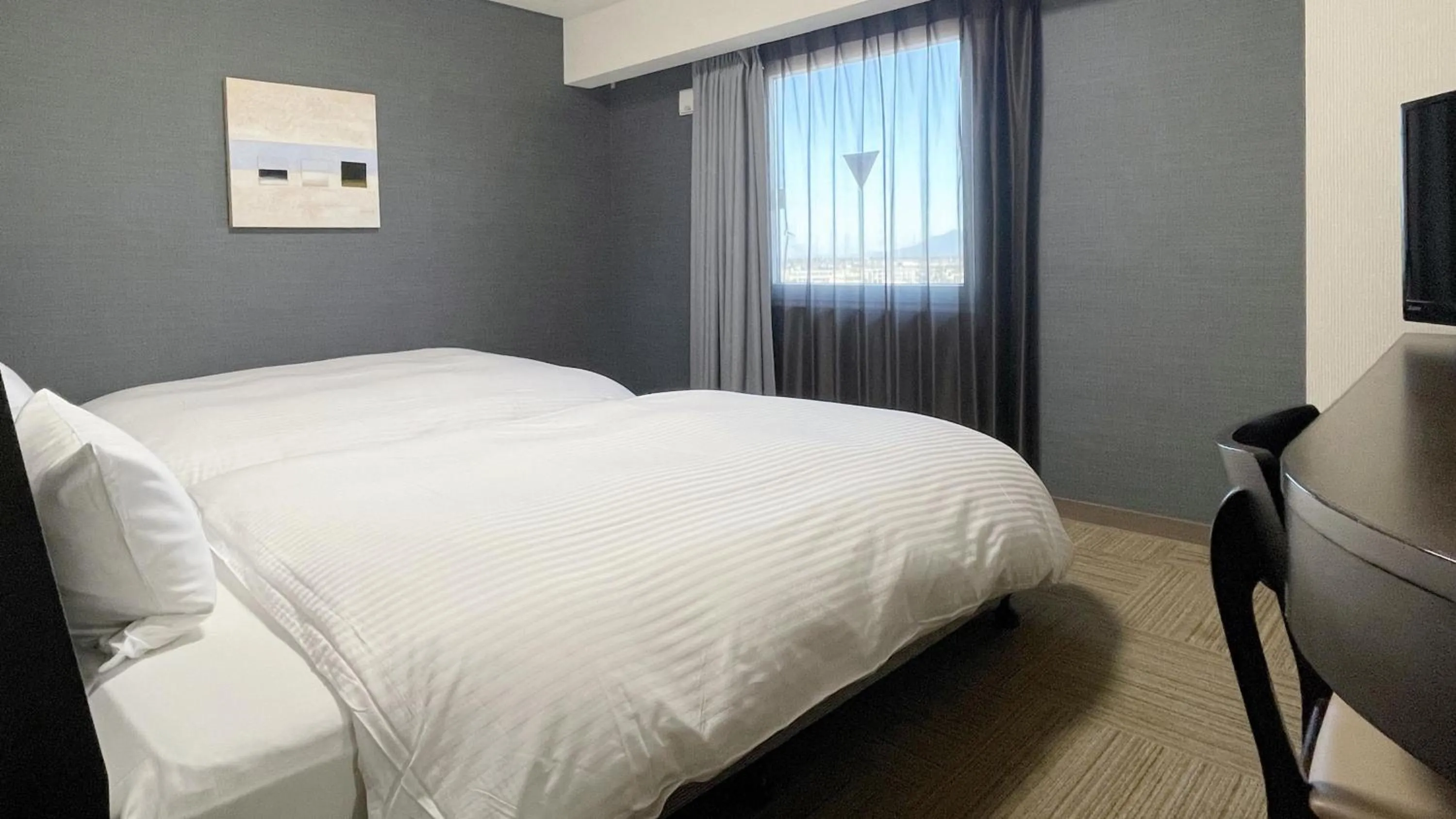 Photo of the whole room, Bed in Hotel Route-Inn Mitsukaido Ekimae