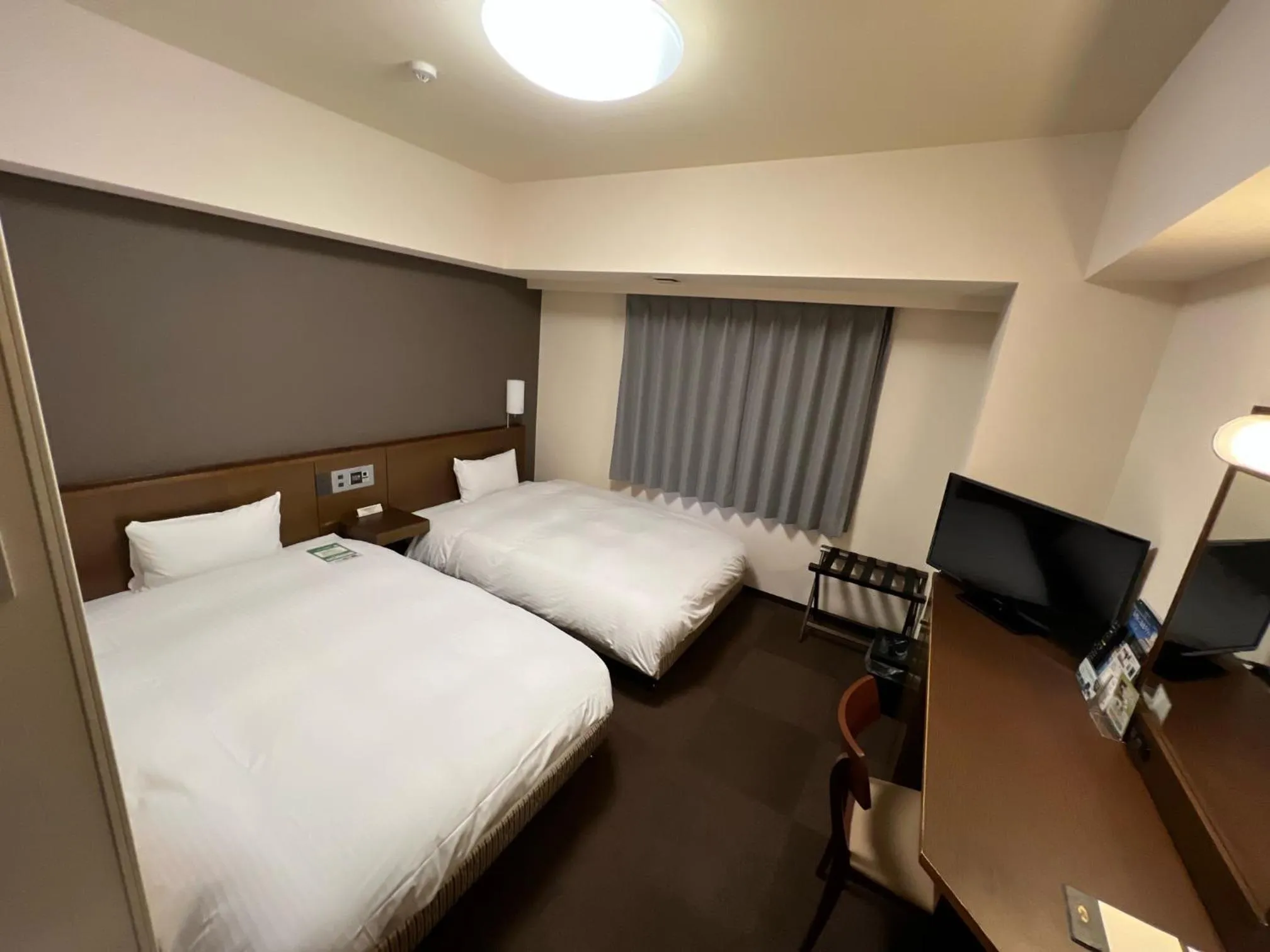 Photo of the whole room, Bed in Hotel Route-Inn Uozu