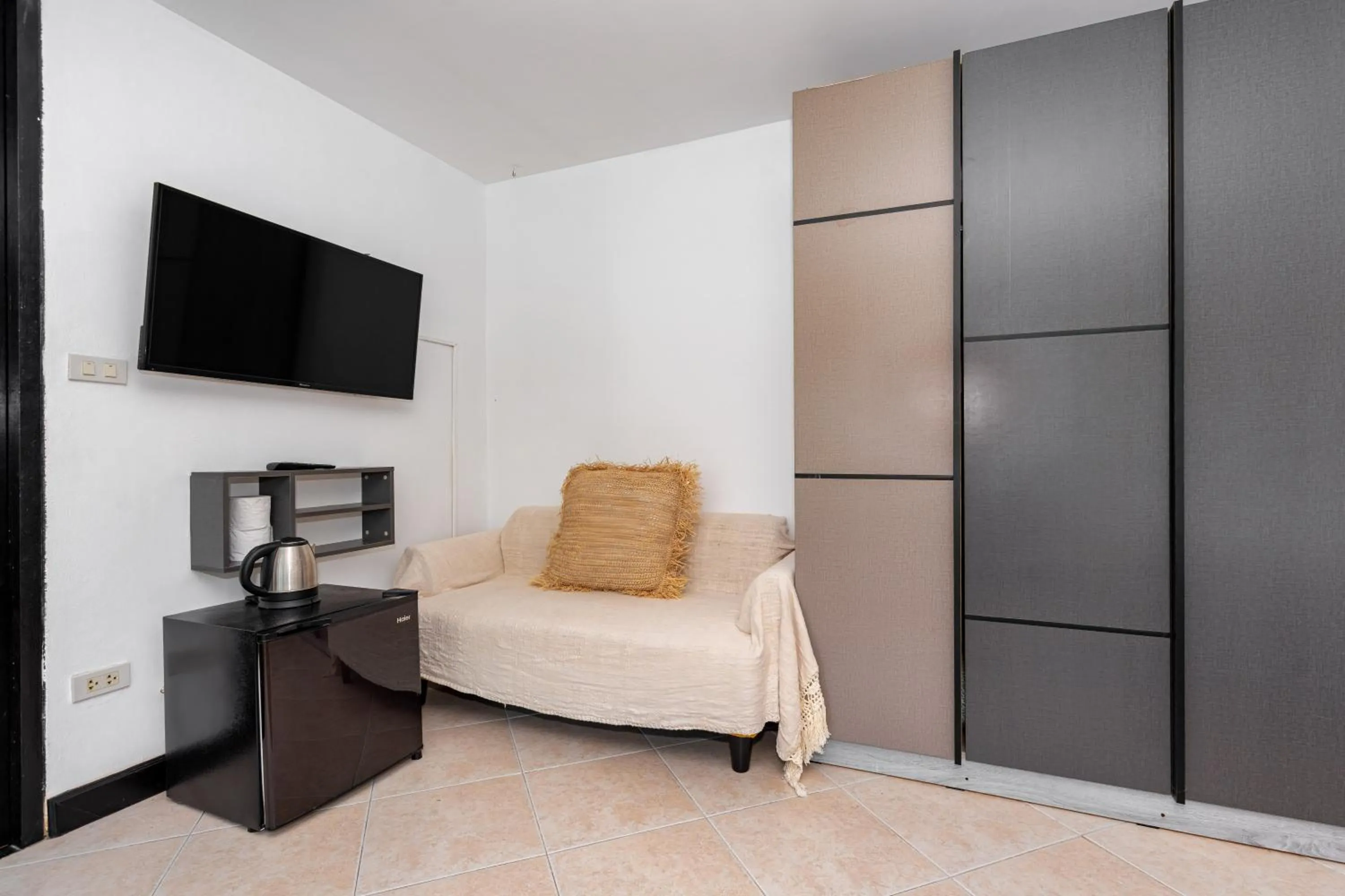 Living room, Bed in Kata Station Boutique Hotel