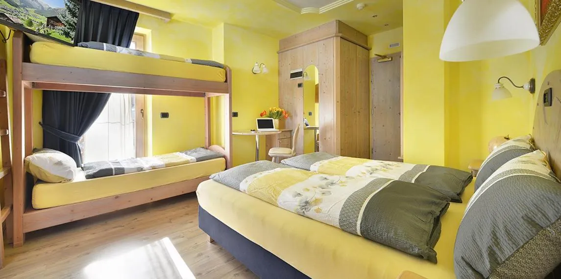 Bed in Hotel Piccolo Mondo