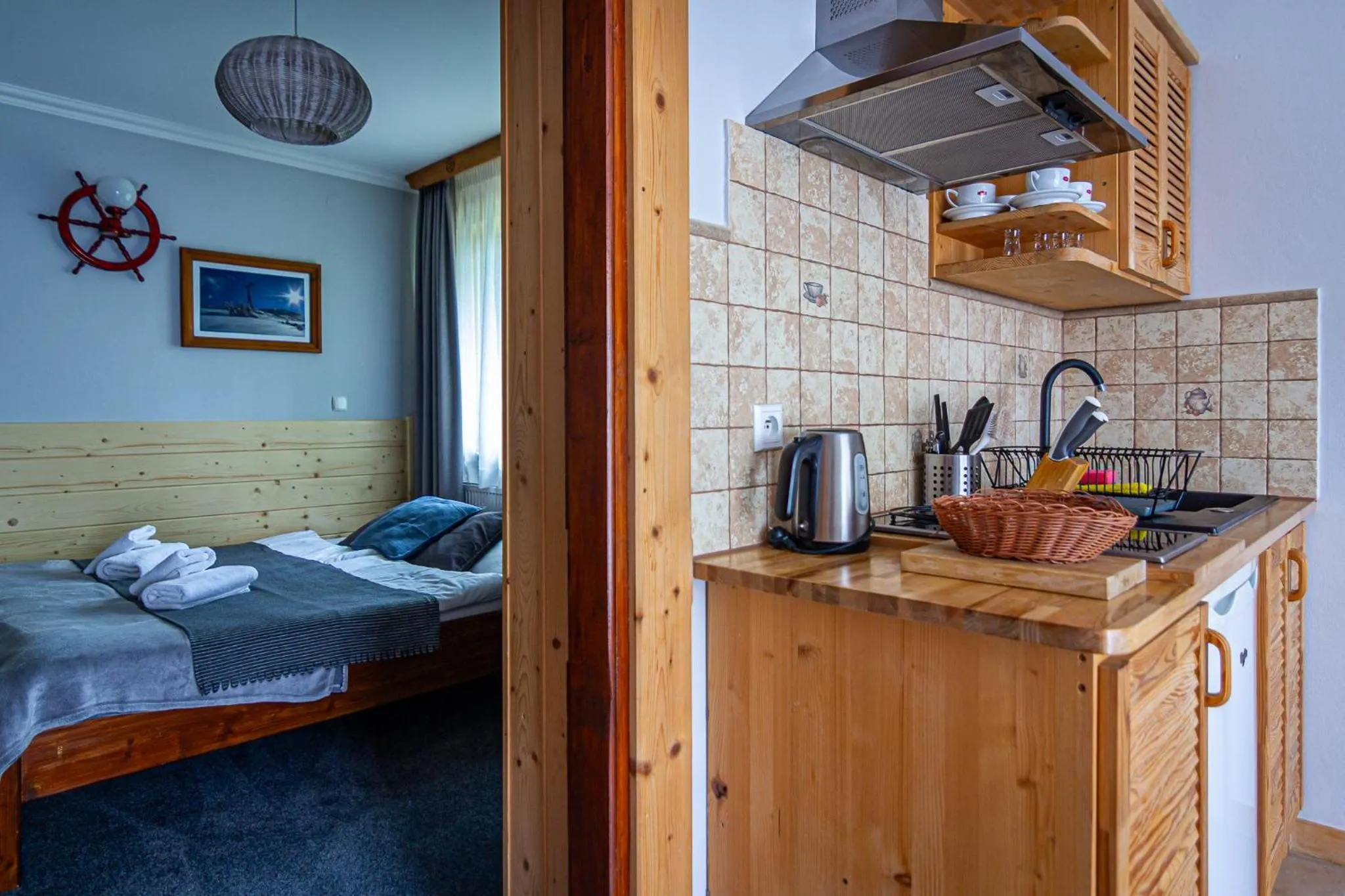 Kitchen or kitchenette, Bed in Aparthotel Pod Nosalem