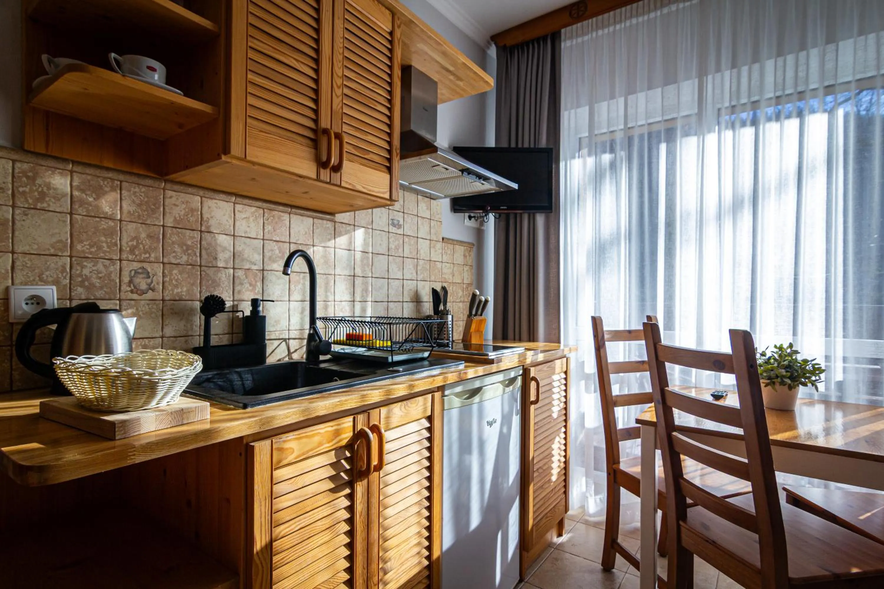 Kitchen or kitchenette in Aparthotel Pod Nosalem