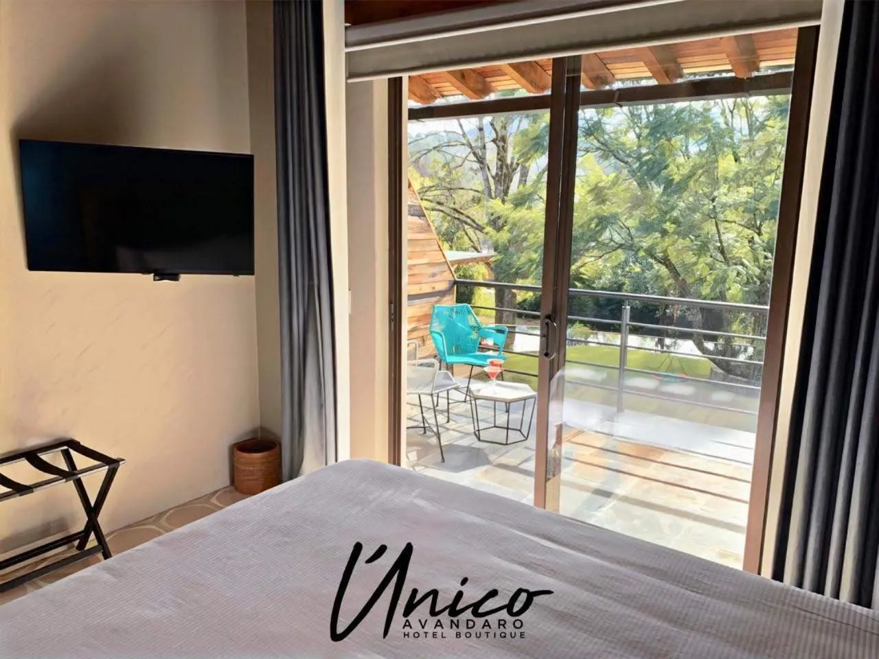 Communal lounge/ TV room, Bed in Hotel Boutique Unico Avandaro