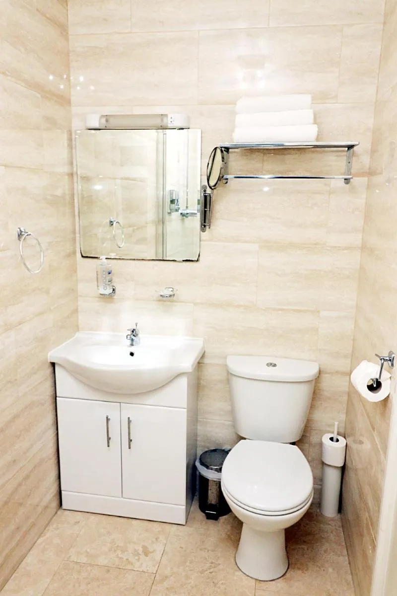 Bathroom in Gatwick Inn Hotel - For A Peaceful Overnight Stay