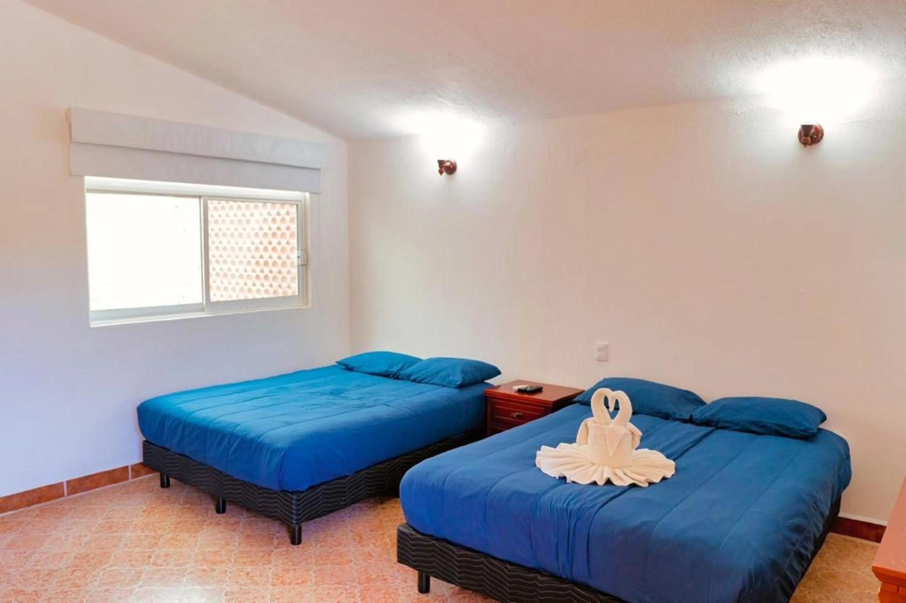Bedroom, Bed in Hotel Rega Suites Guayabitos - Family & Kitchen