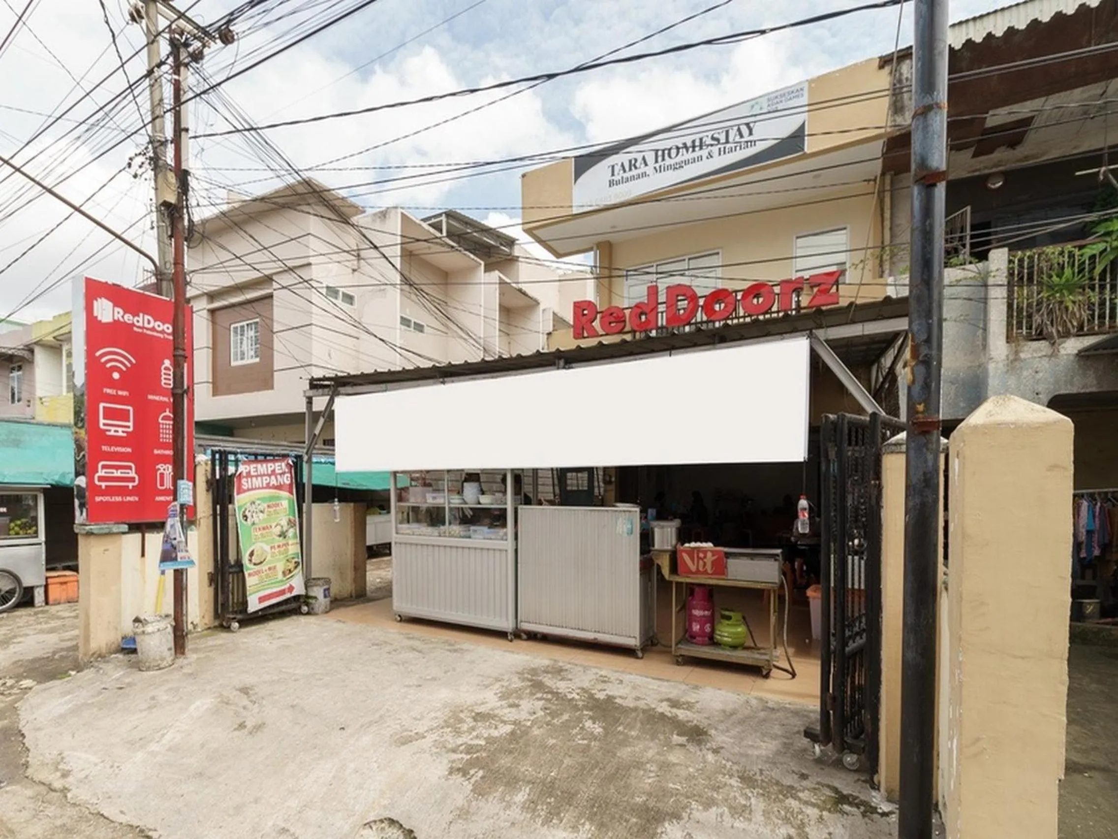 Property logo or sign in RedDoorz at Tara Homestay Palembang