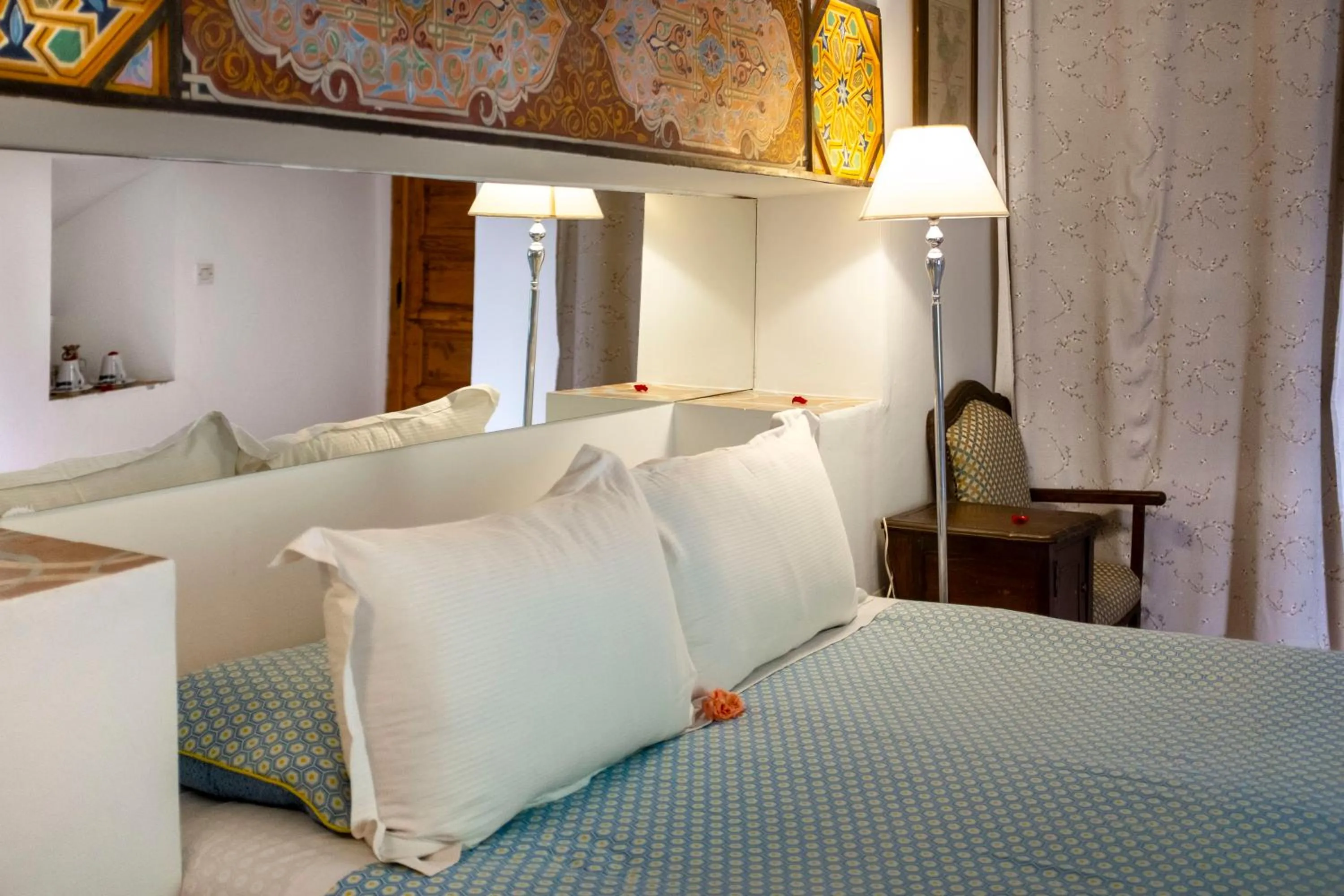 Bed in Riad Le Coq Berbère