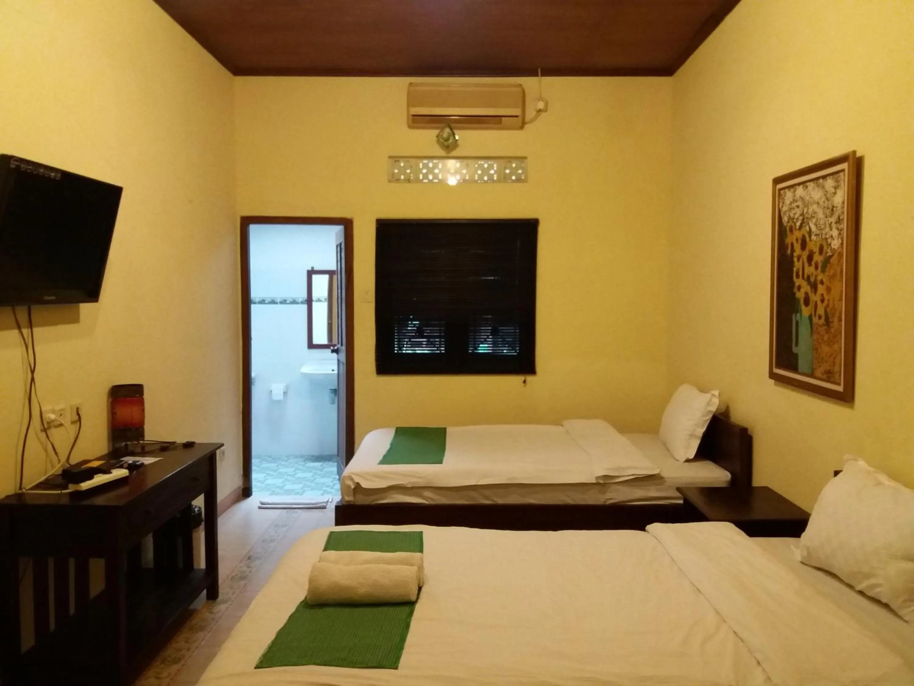Bed in Alam Jogja Resort Mitra RedDoorz