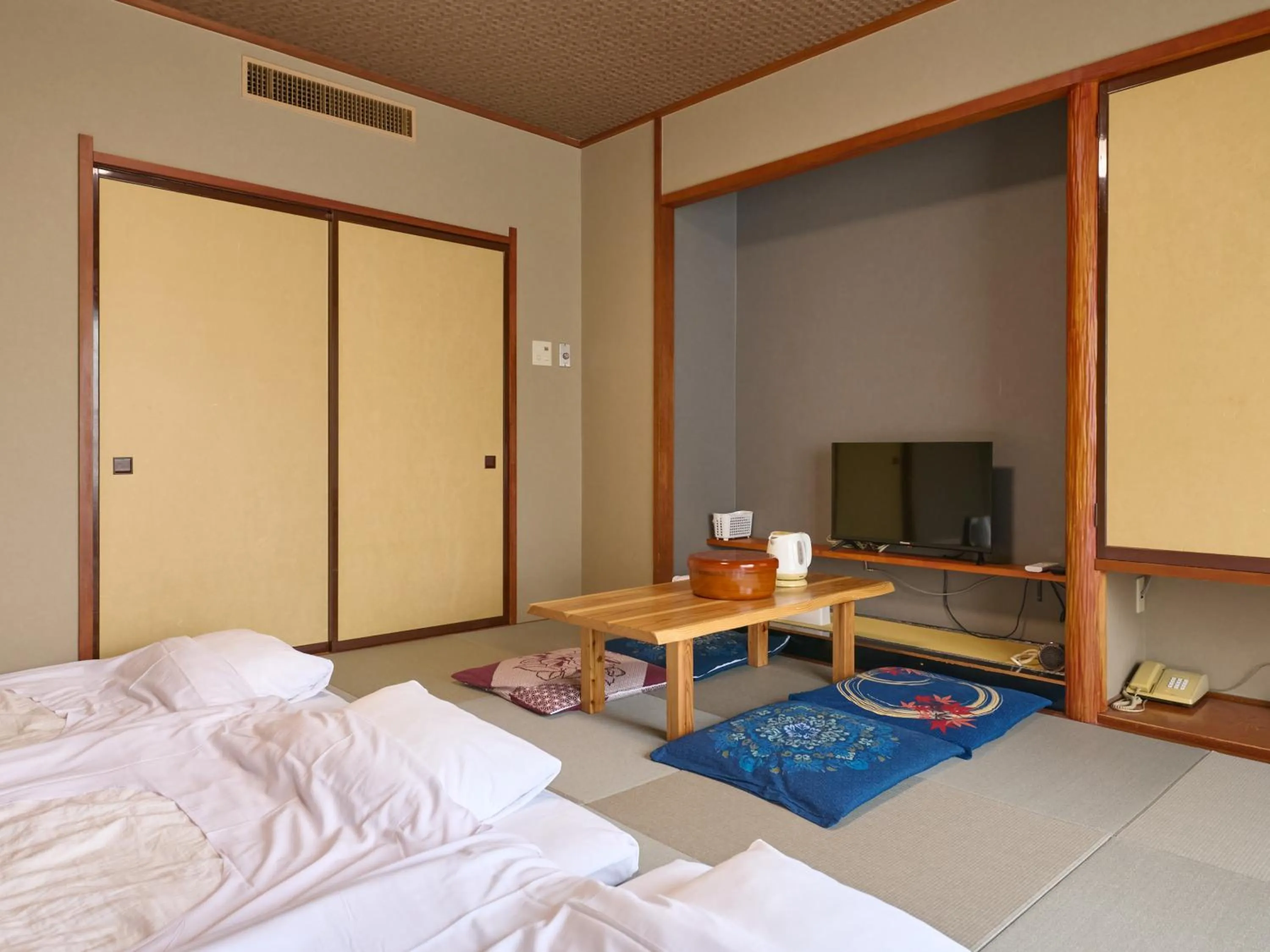 Bed in Tabist Hotel Seishokan