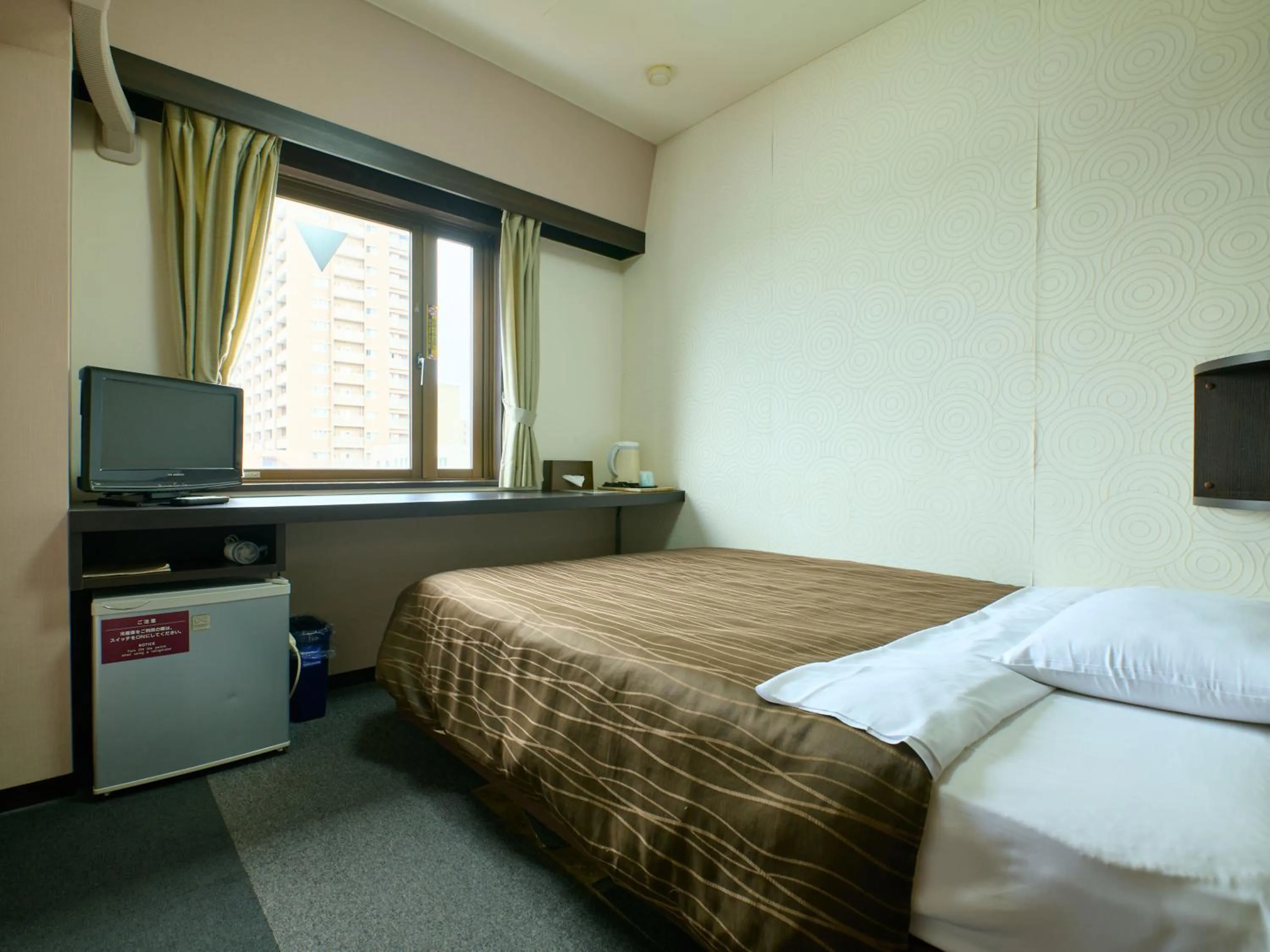 Bed in Tabist Hotel Seishokan