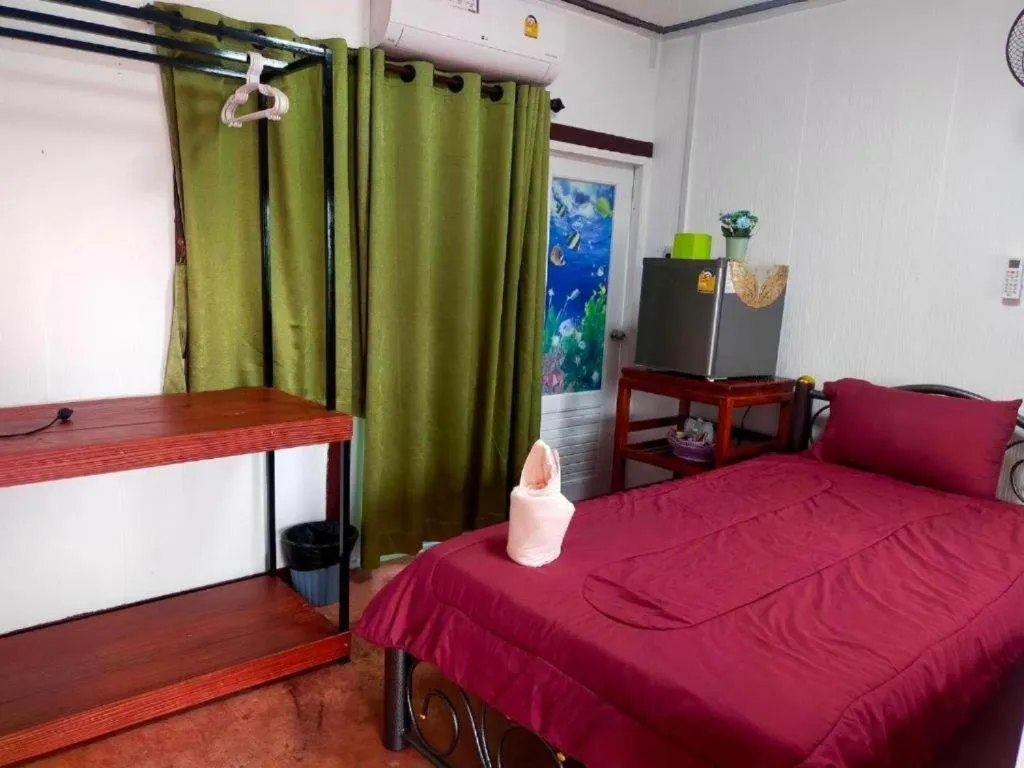 Bed in Baan Sabaijai Resort