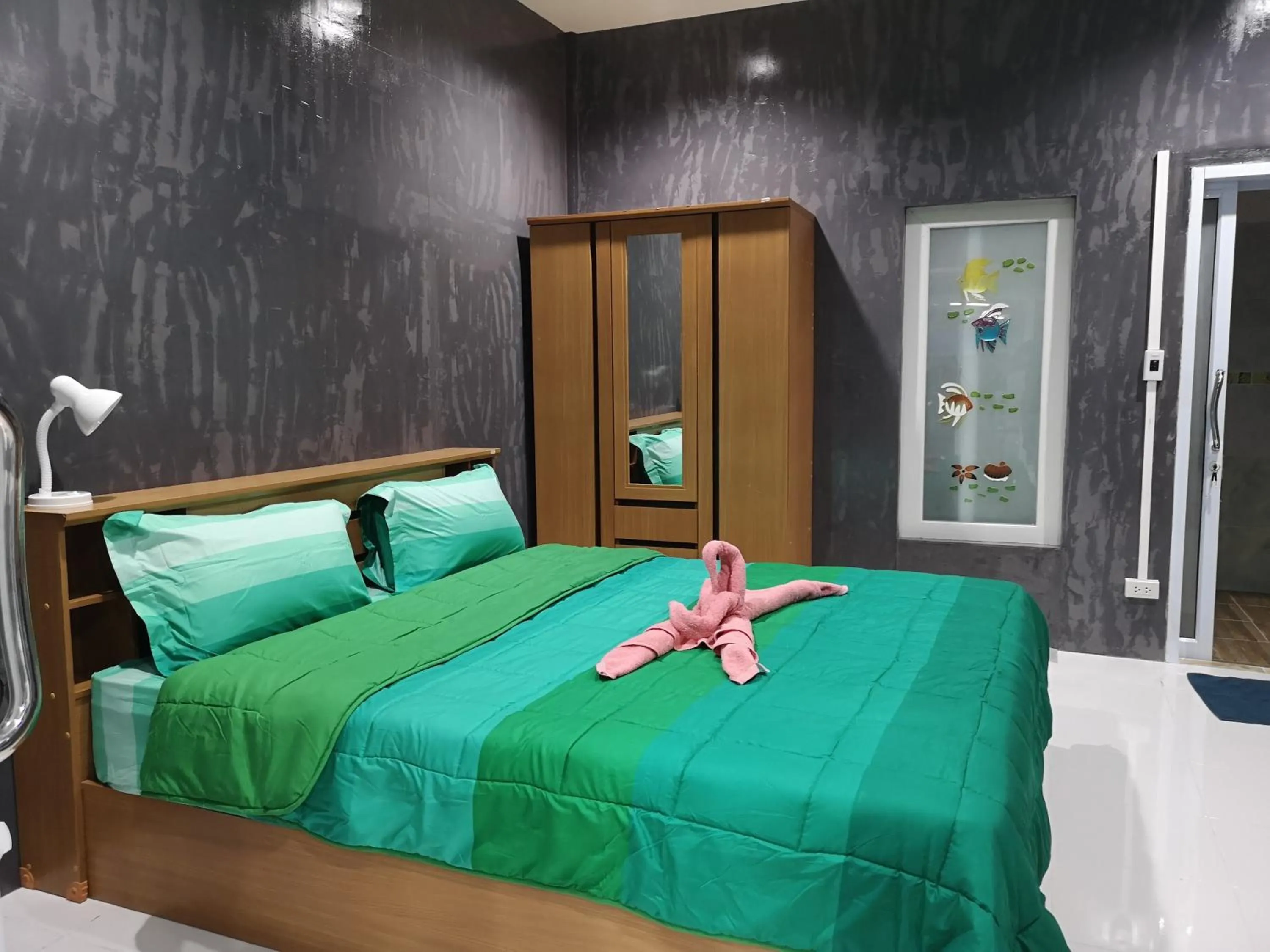 Bed in Baan Sabaijai Resort