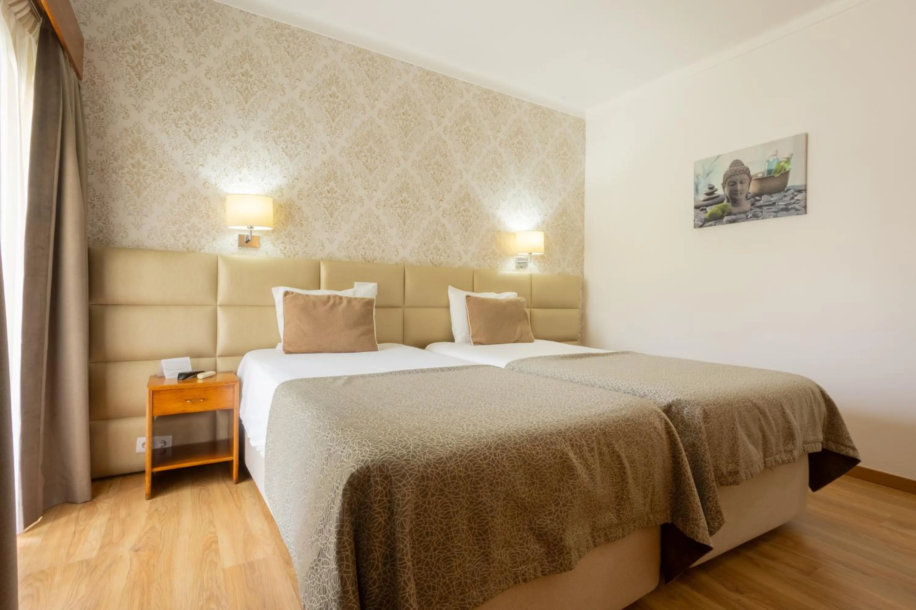 Bed in Hotel Sao Jorge Garden