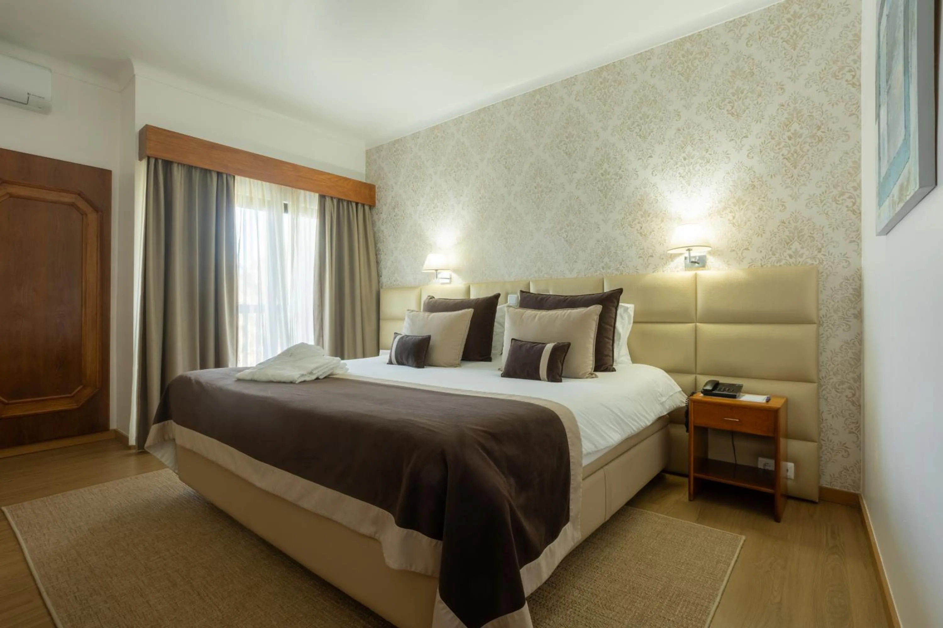 Bed in Hotel Sao Jorge Garden