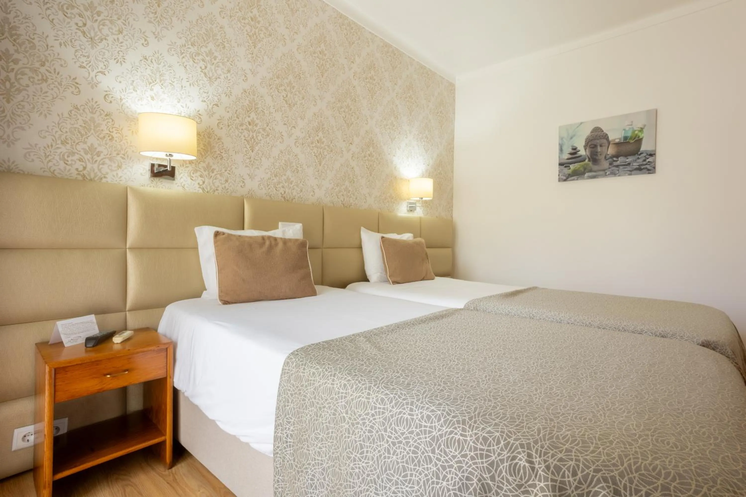 Bed in Hotel Sao Jorge Garden